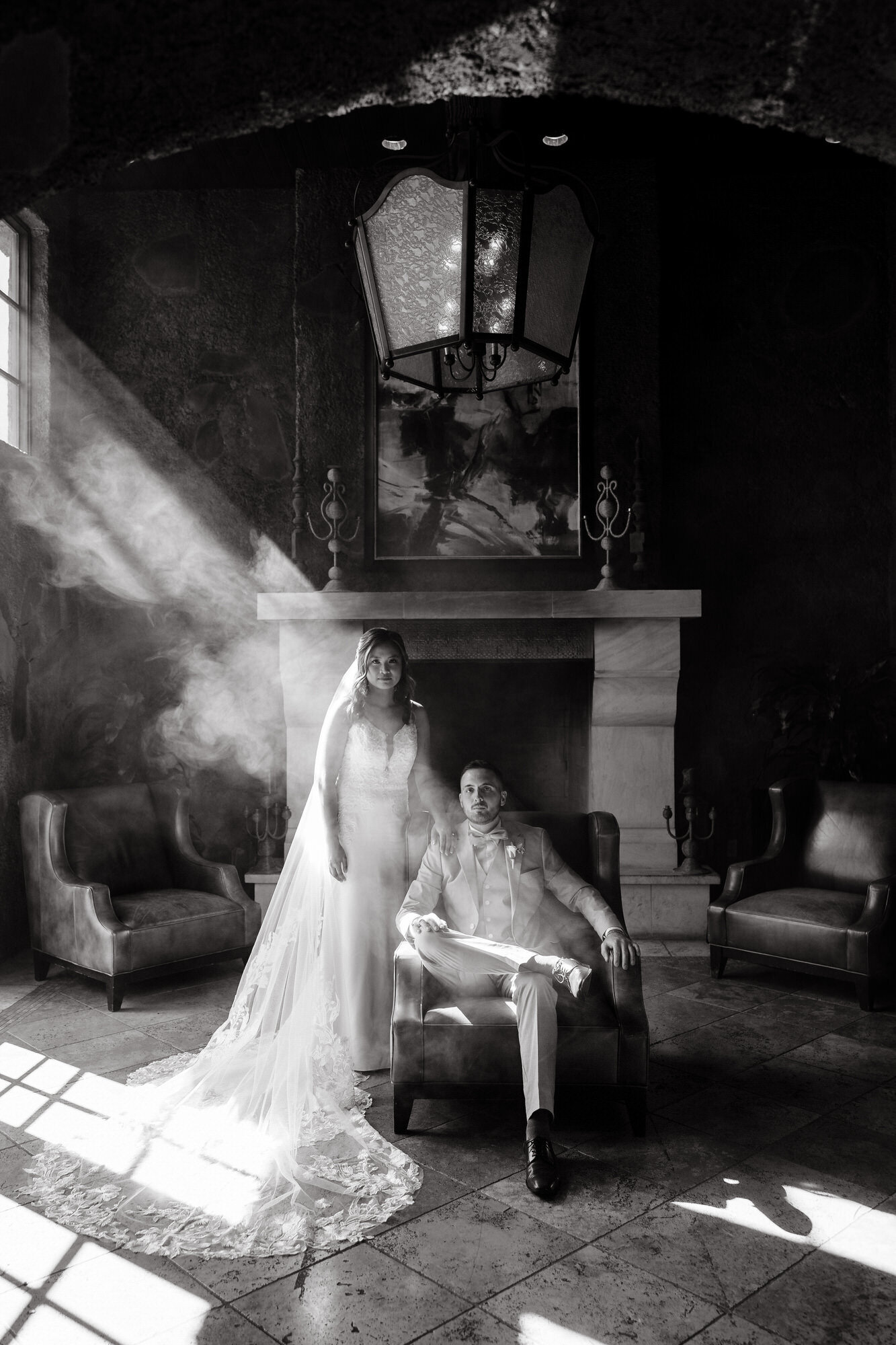 Bride and groom posing for portrait at Encanterra Golf Club wedding venue taken by Arizona wedding videographer