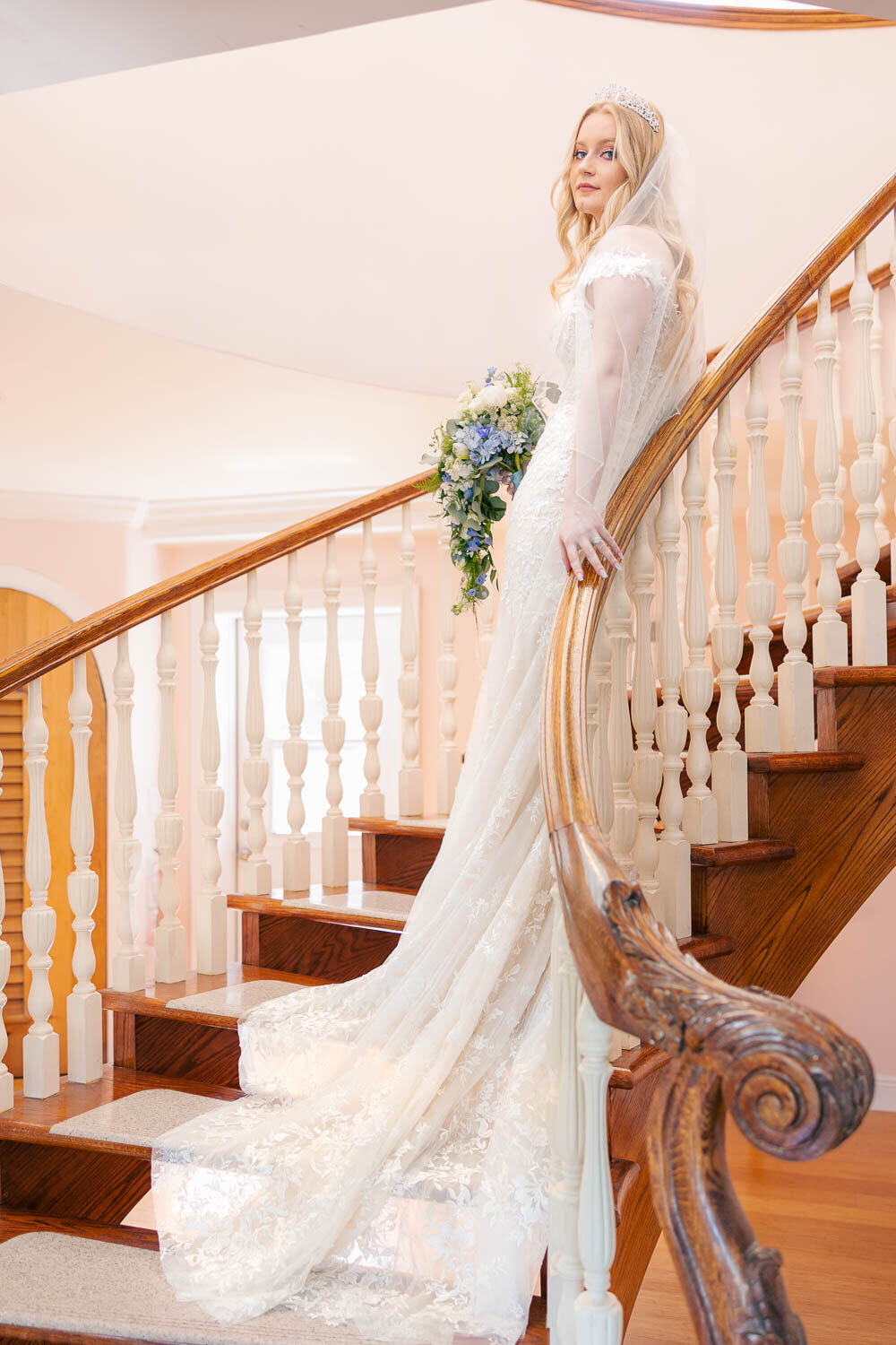 bride posing on staircase.