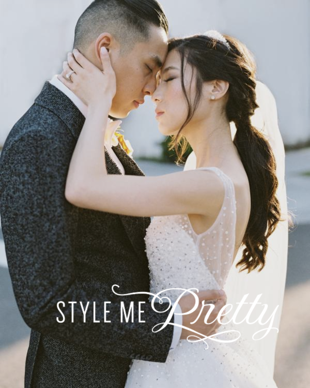 Kohnur bride with glowing dewy makeup, peach lipstick, and soft eyeliner in romantic outdoor golden hour wedding editorial featured on Style Me Pretty