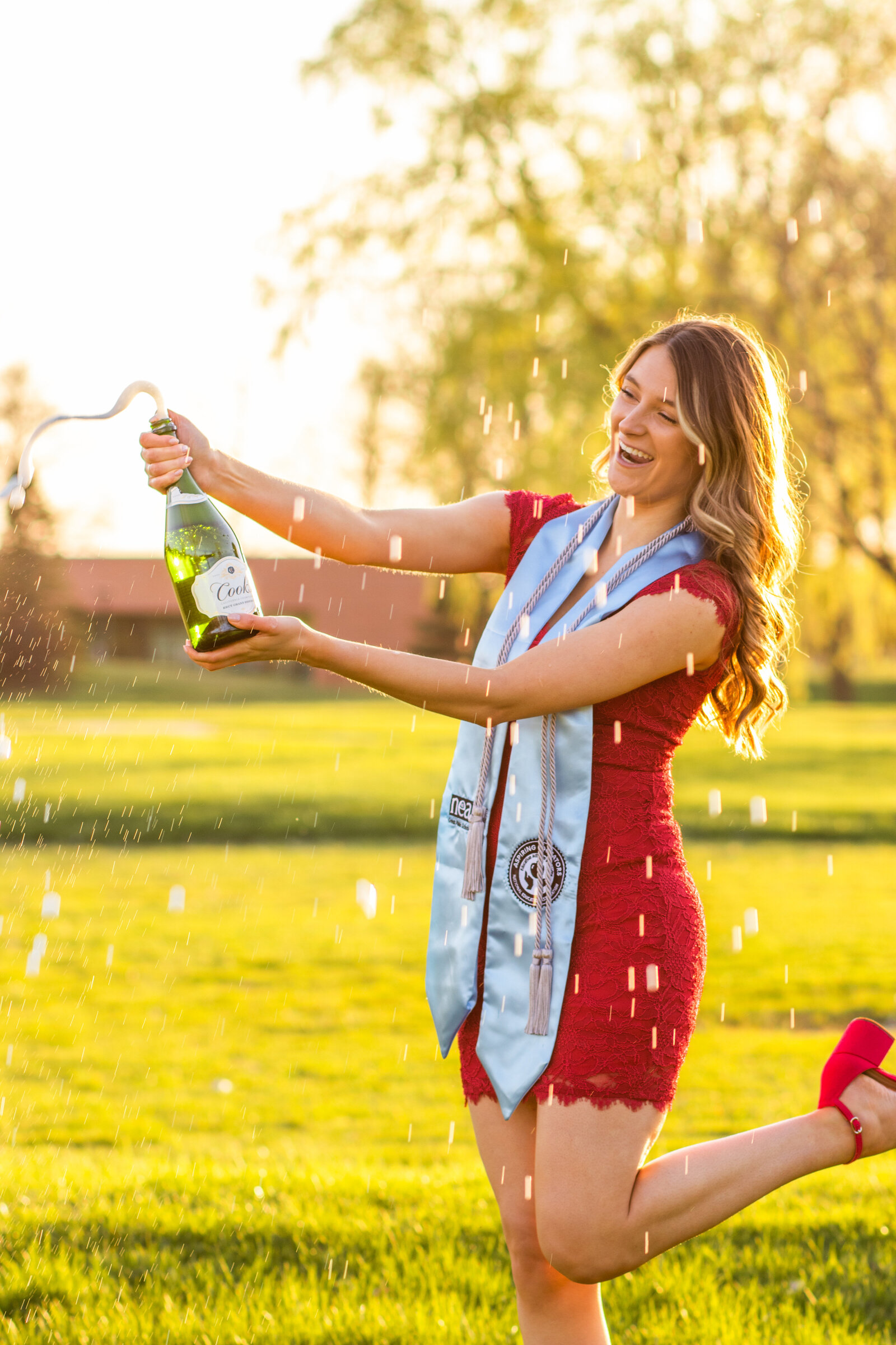 Saginaw Valley State University senior portraits with champagne
