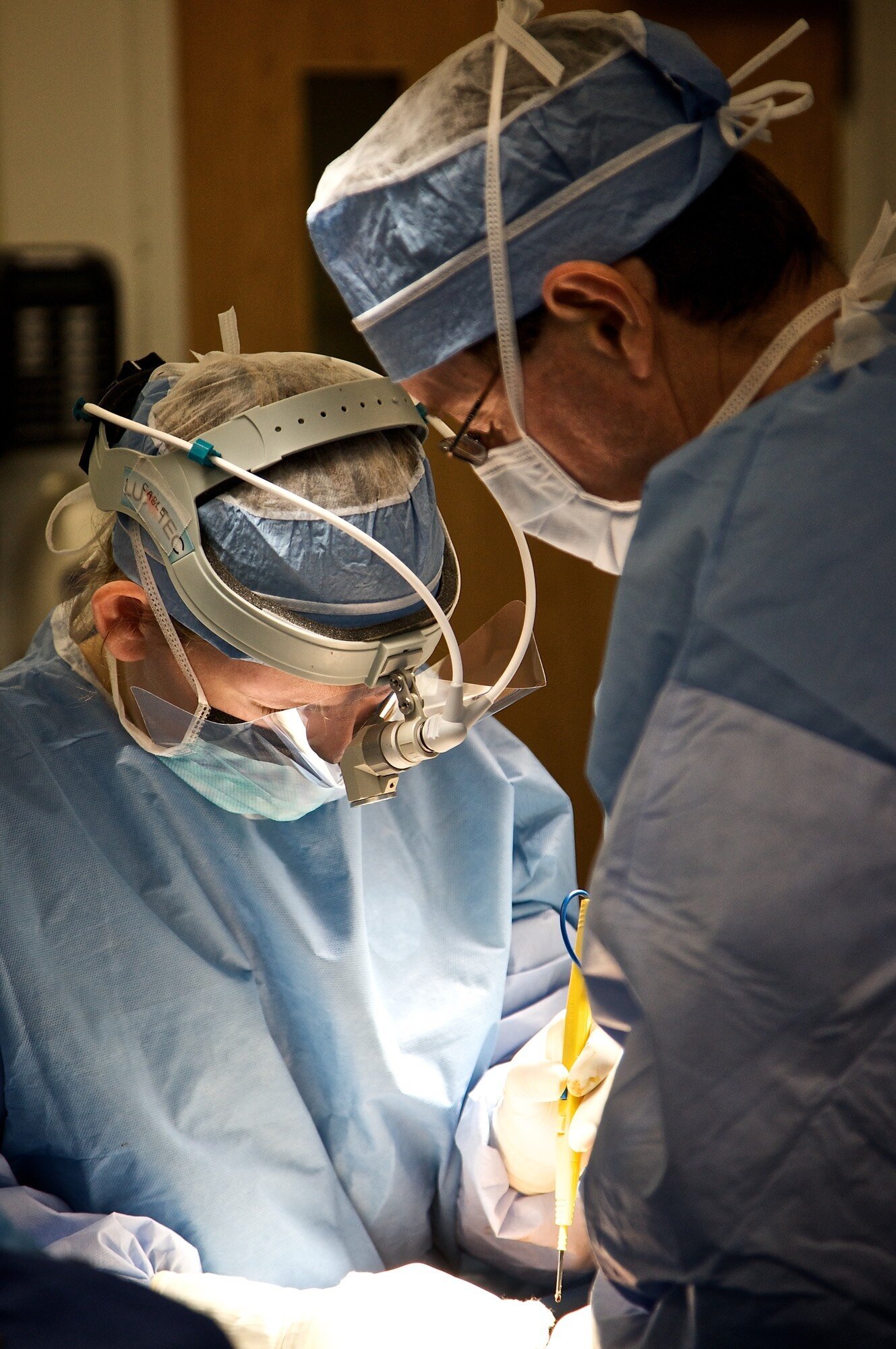 Doctor performing surgery in operating room
