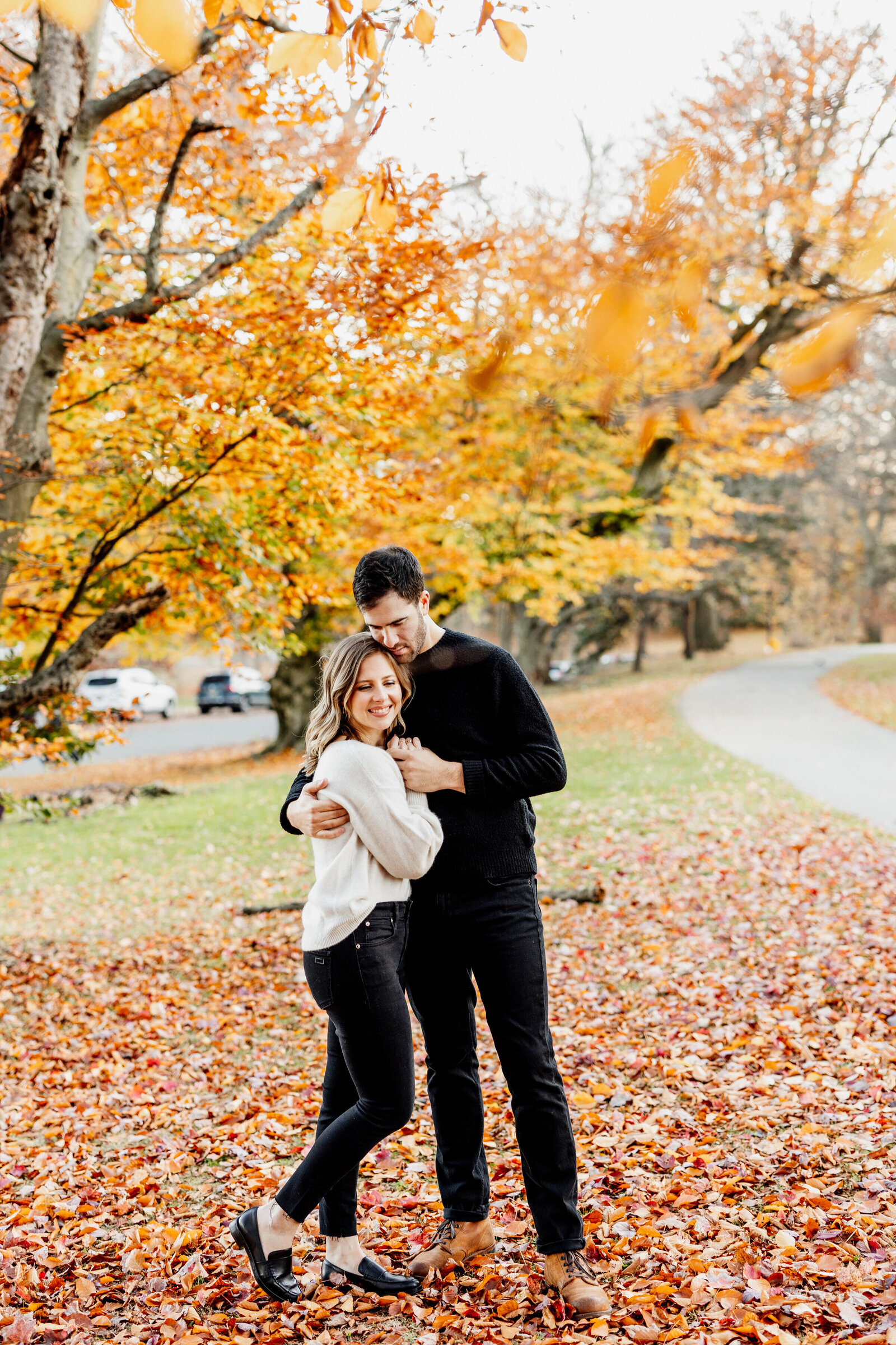 couple in colorful fall leaves