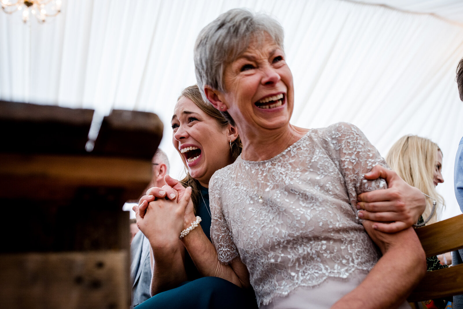 a funny moment between bridesmaid and mother of the bride during wedding speech
