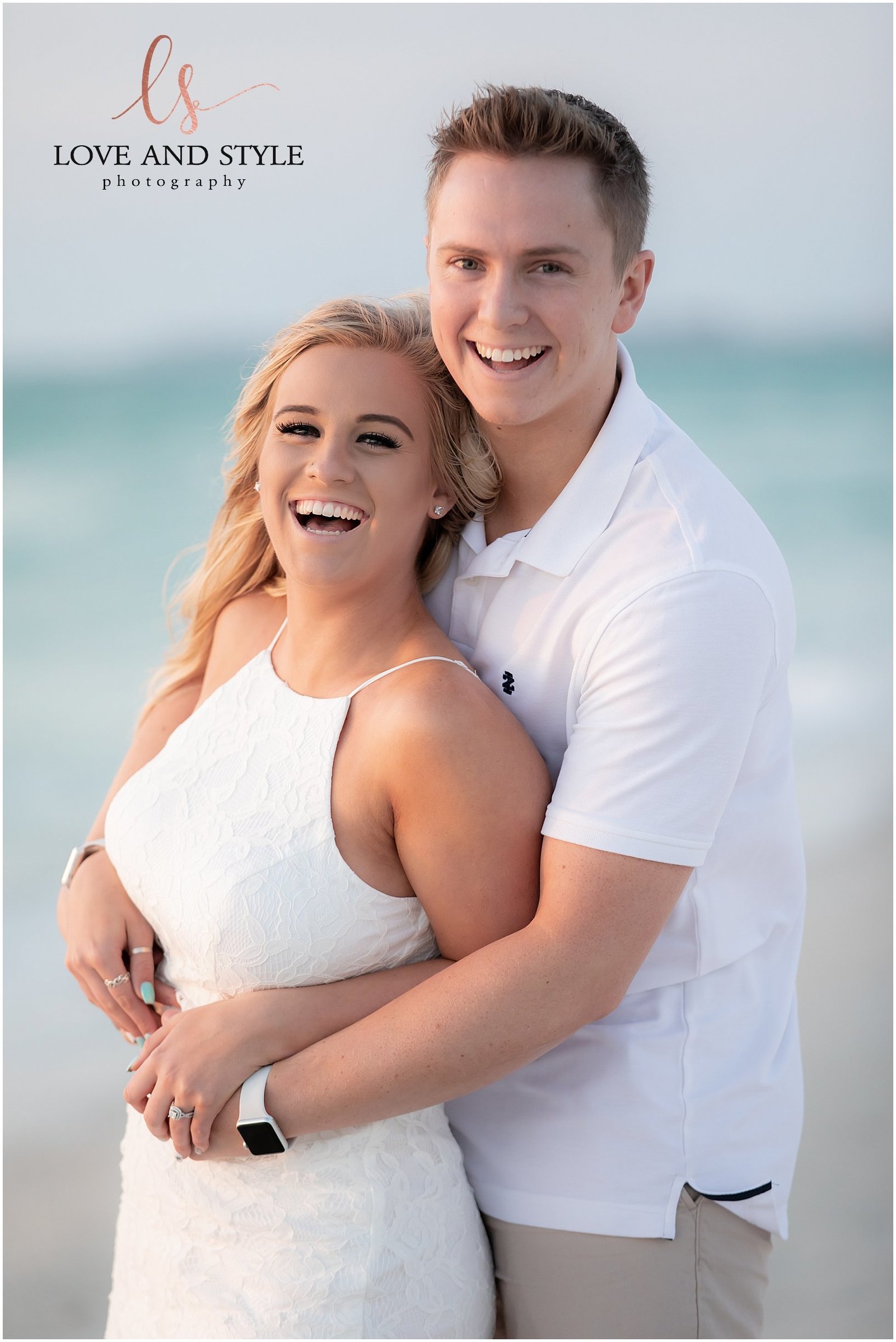 A close up picture of an engaged couple wearing white at Anna Maria Island