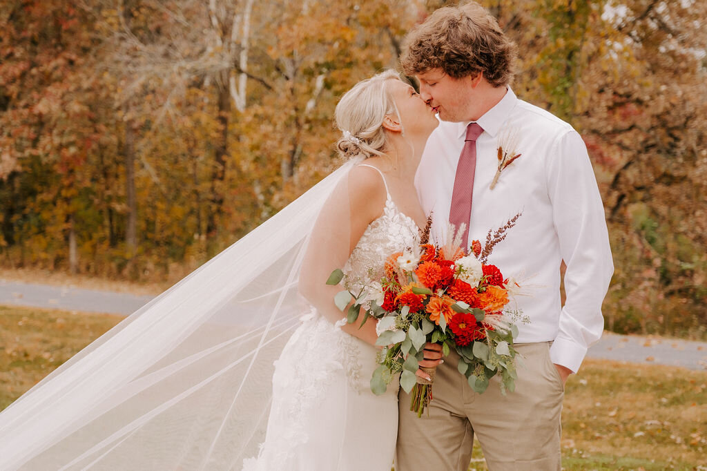 A newly married couple celebrating with family and friends at Echo Valley’s unique, rustic venue.