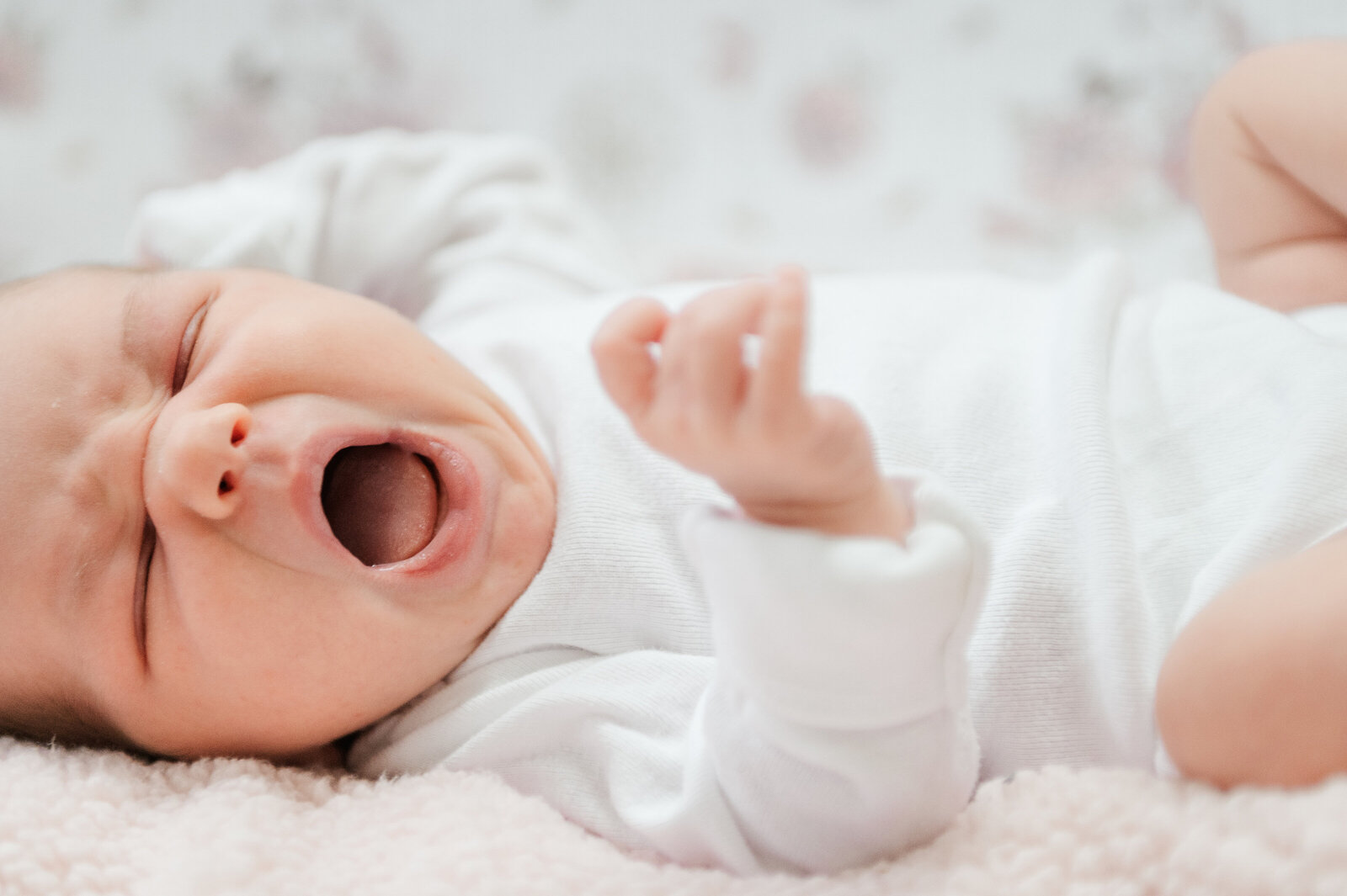 newborn baby girl yawning during session in harrisburg pa