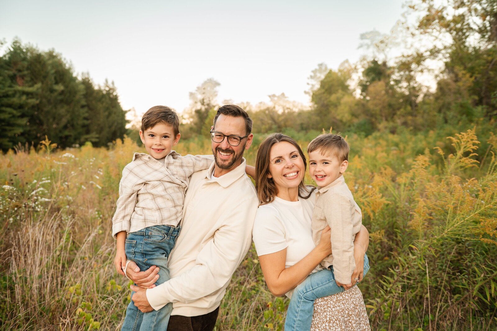 Playful moment of dad spinning his child during a candid session with a Baltimore family photographer.