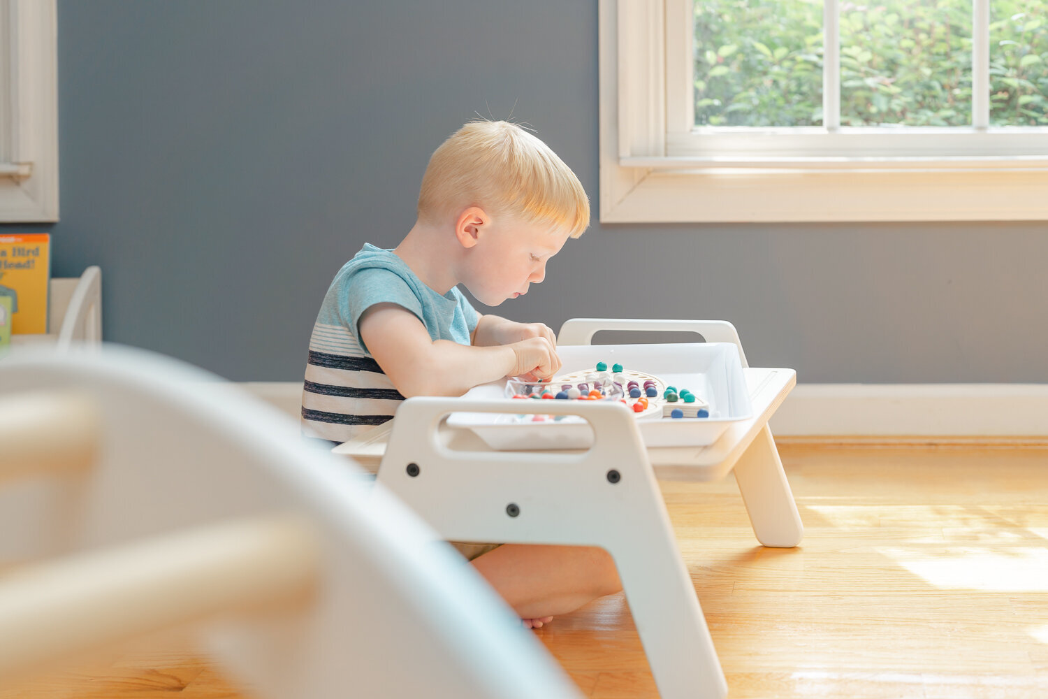 boy playing with activity board during product photography Vienna,Virginia