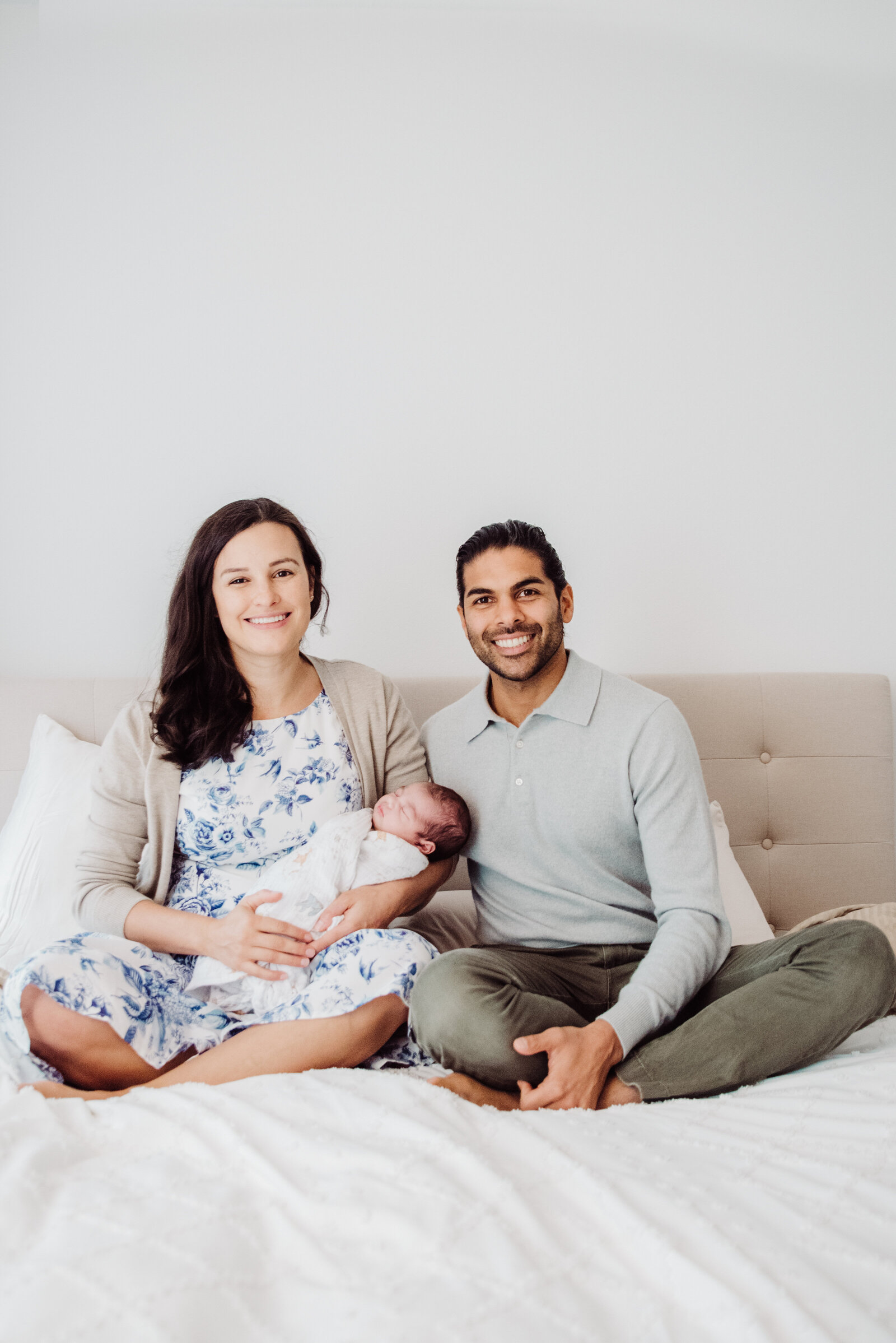 Capture the love and joy of welcoming a new baby with light-filled, in-home newborn photography in Connecticut. This heartfelt session showcases a growing family in a cozy, natural setting, highlighting the warmth and connection between parents and their little one. Book your session to preserve these cherished early moments forever.