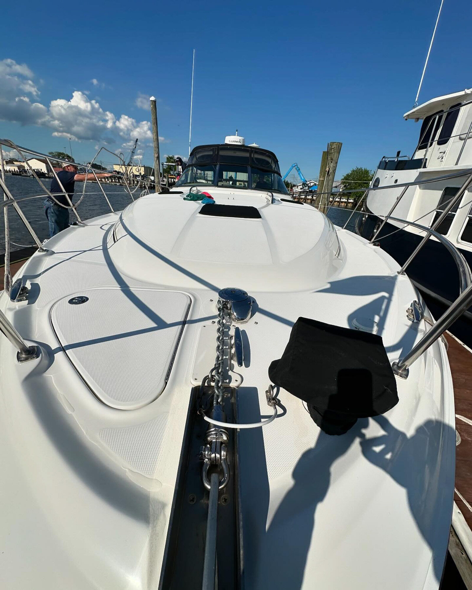 Front deck of a clean yacht at a marina