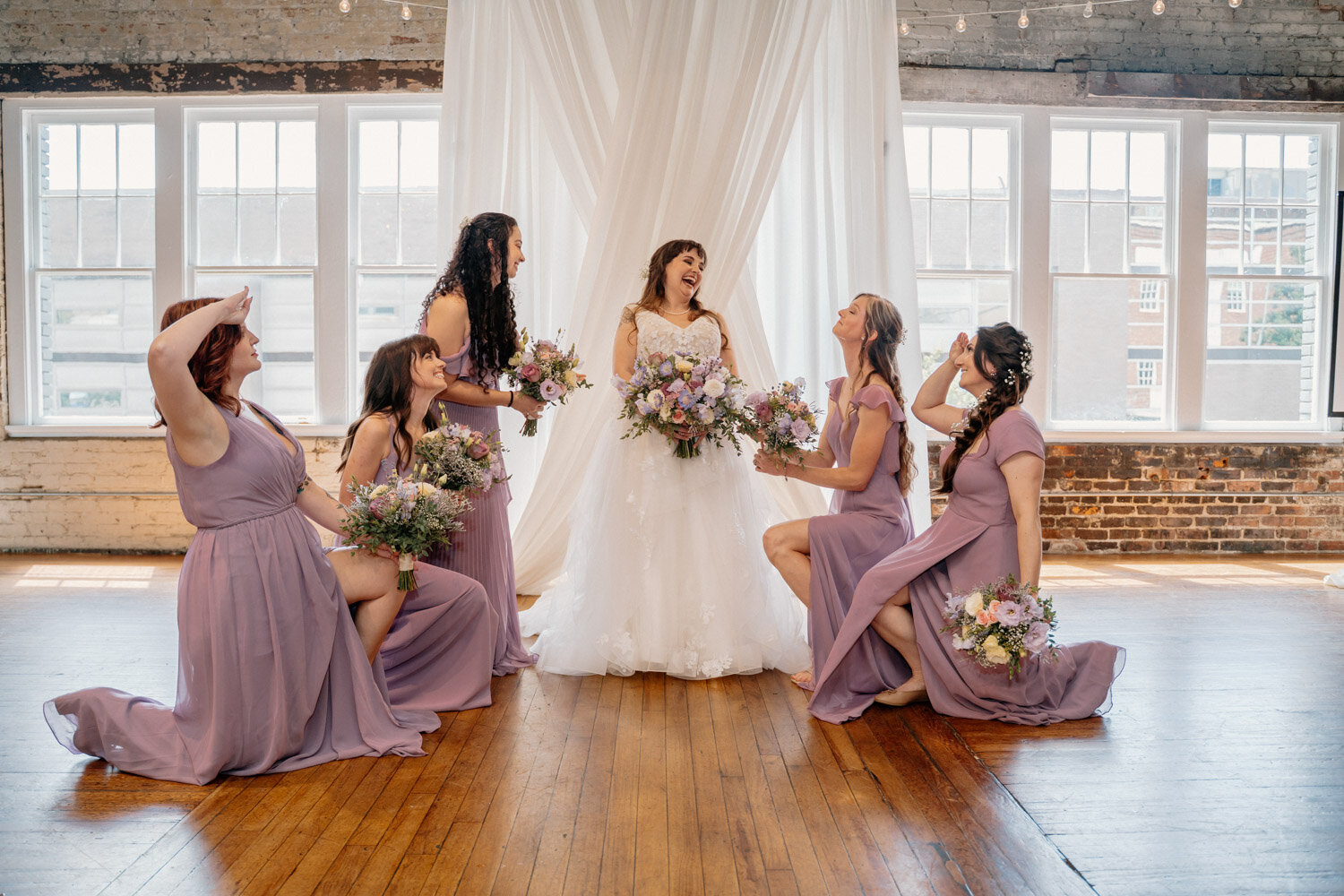 Bride and her wedding party in an indoor setting