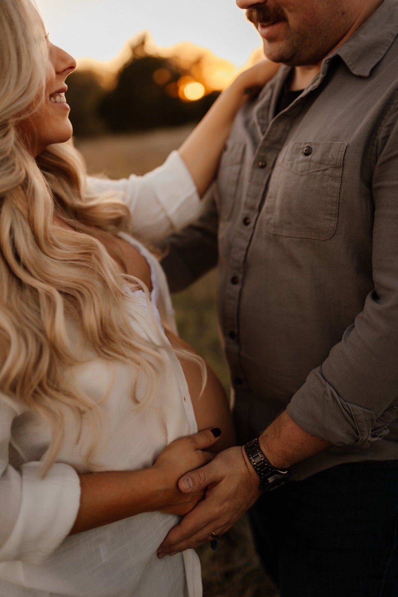 Baby girl is looking at his brother in this sweet family photo taken by Gillan Oler