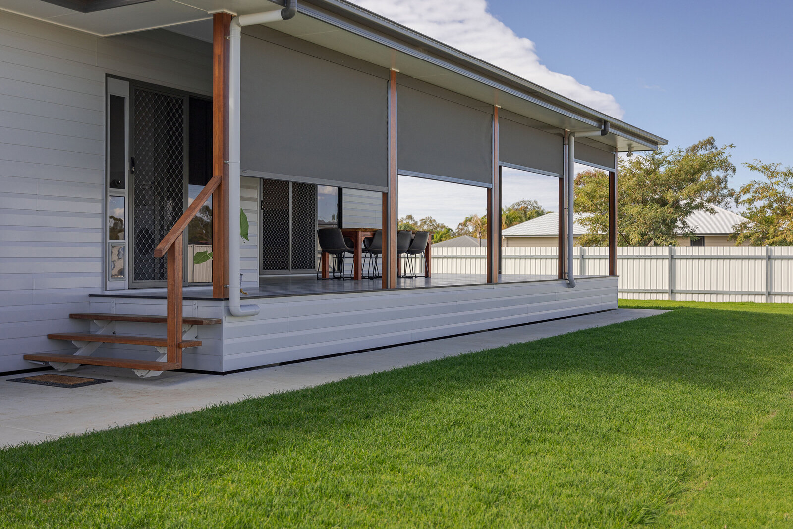 Spacious outdoor patio with sliding aluminium doors and energy-efficient glass windows, tailored for residential needs