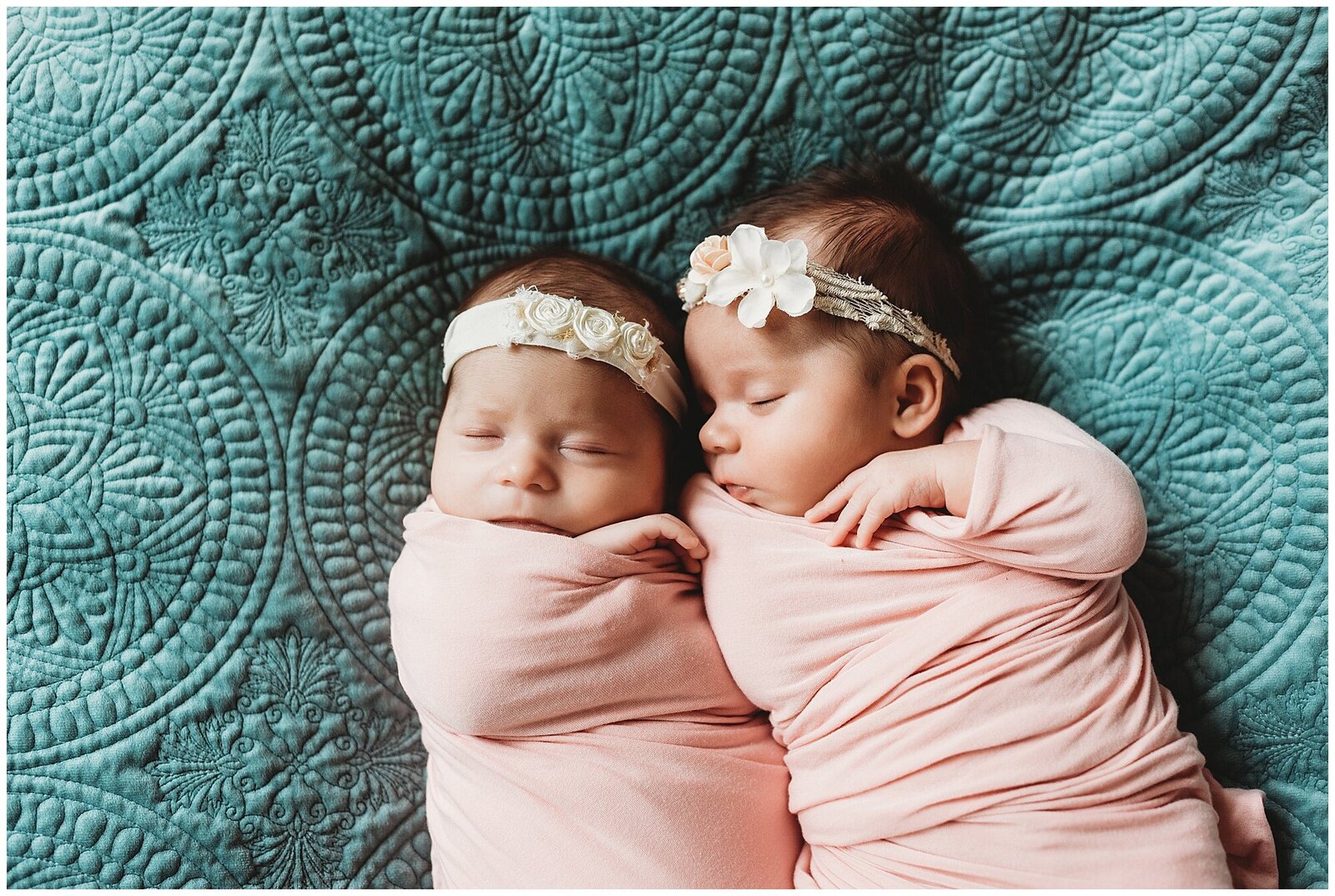 newborn twin girls in pink swaddles on turquoise velvet seattle photographer Emily Ann Photography