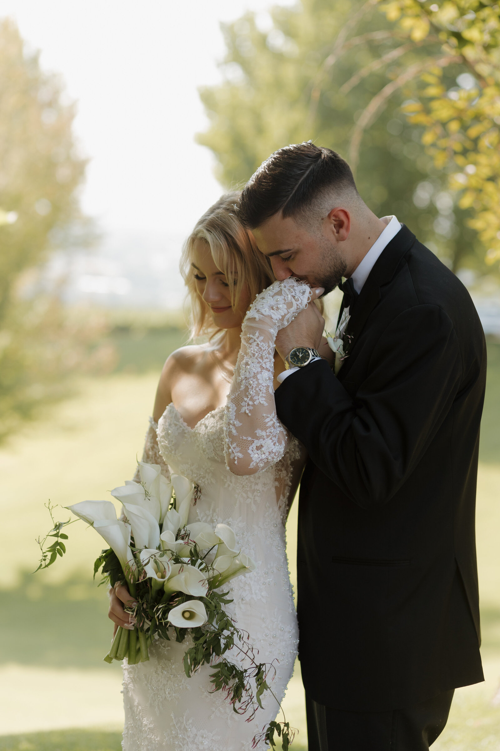 groom-kissing-bride-hand