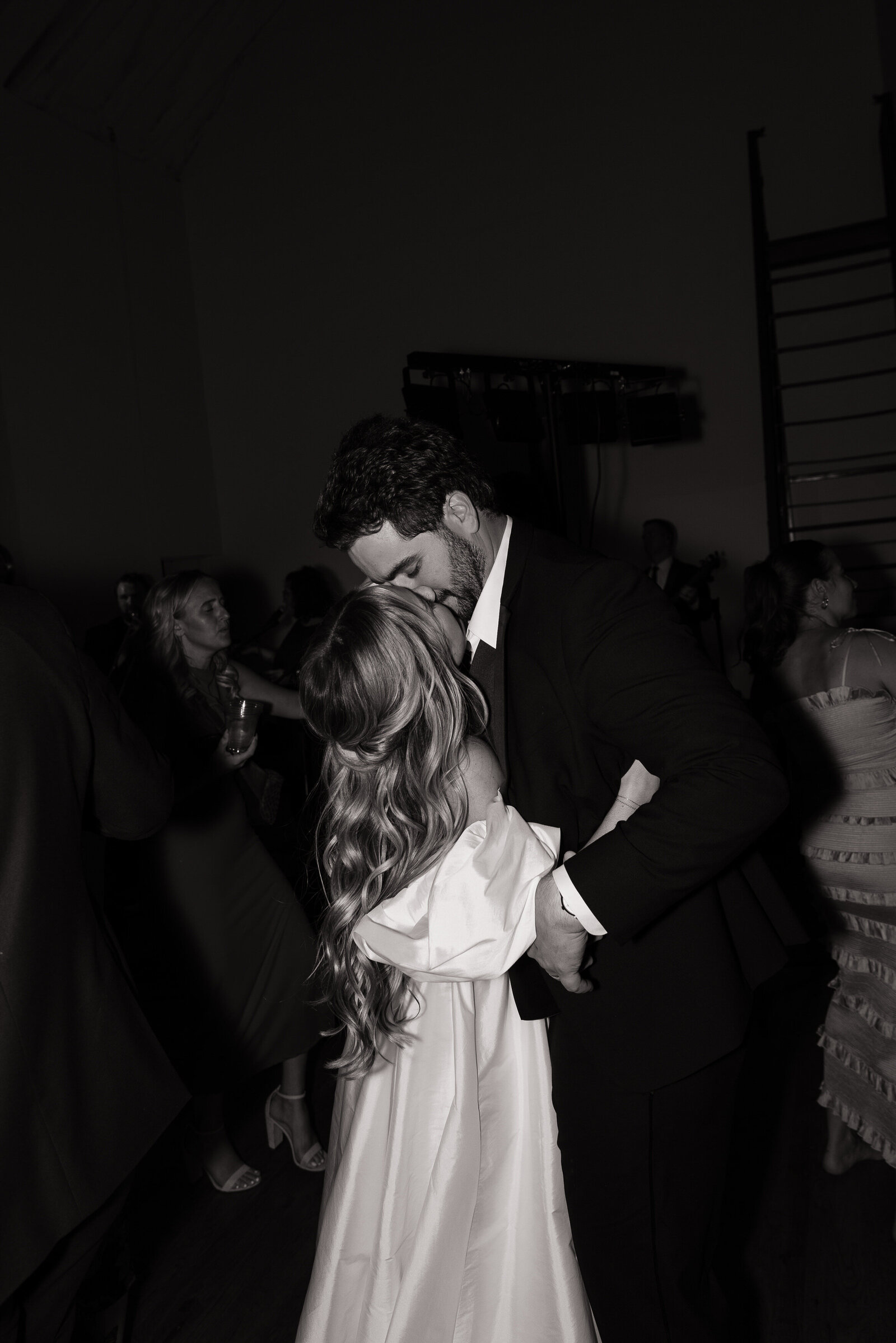 Bride and groom kiss while dancing during reception at TRICA in Boise