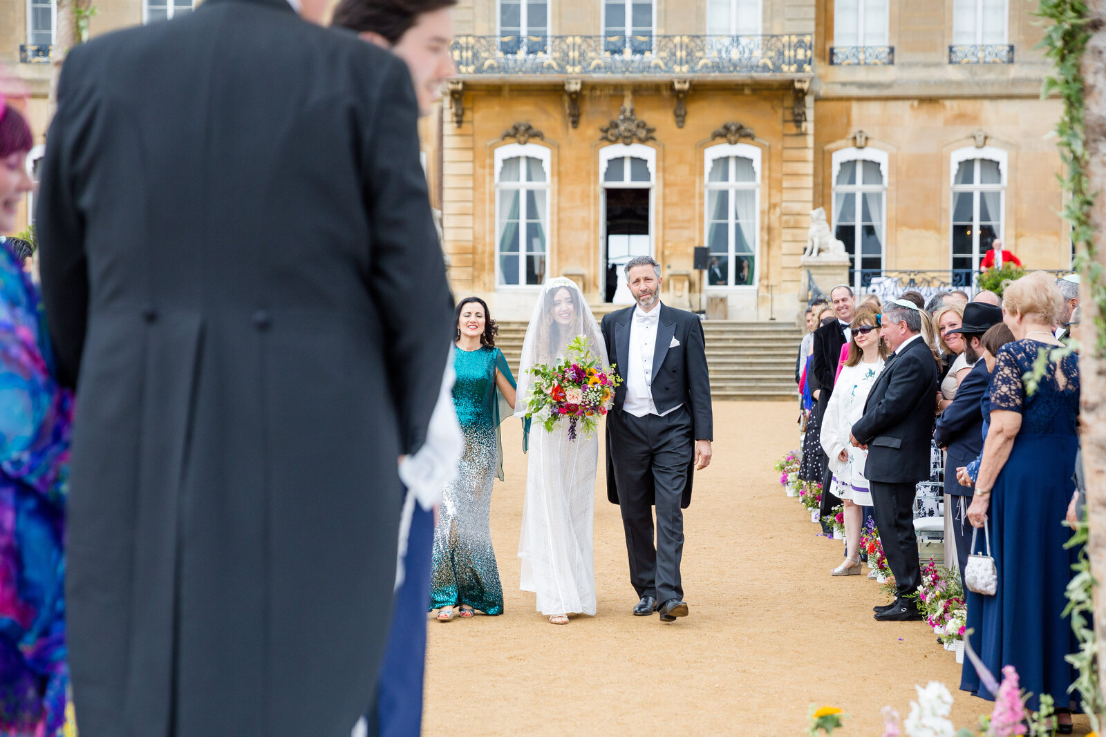 TheBride is escorted down the aisle with her Parents at Wrest Park