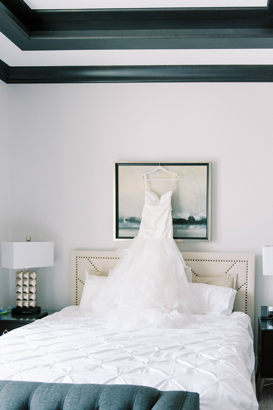 wedding dress hanging from picture on wedding day
