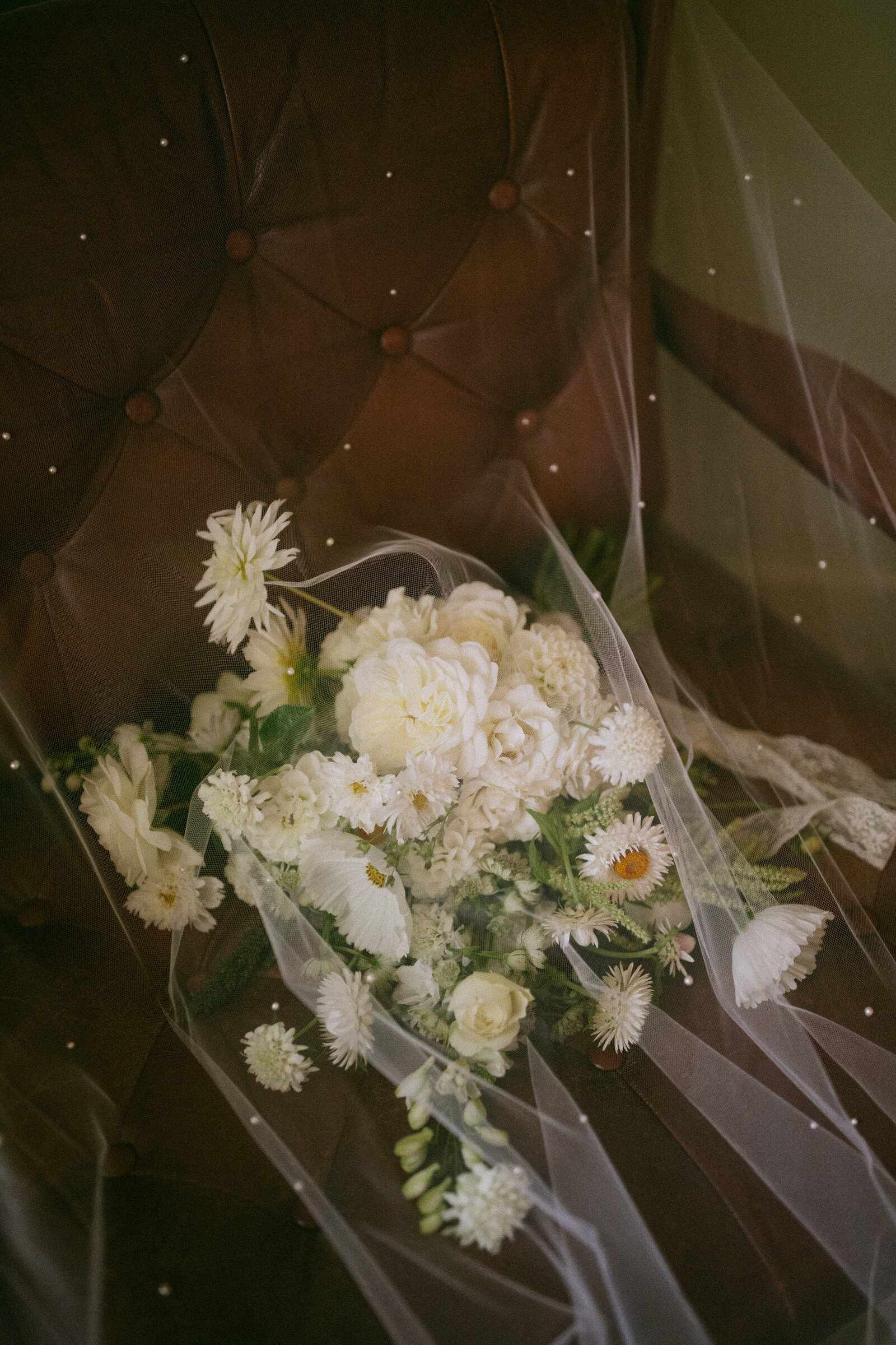 Film photo of bride's bouquet under veil in getting ready suite for intimate Northern California wedding