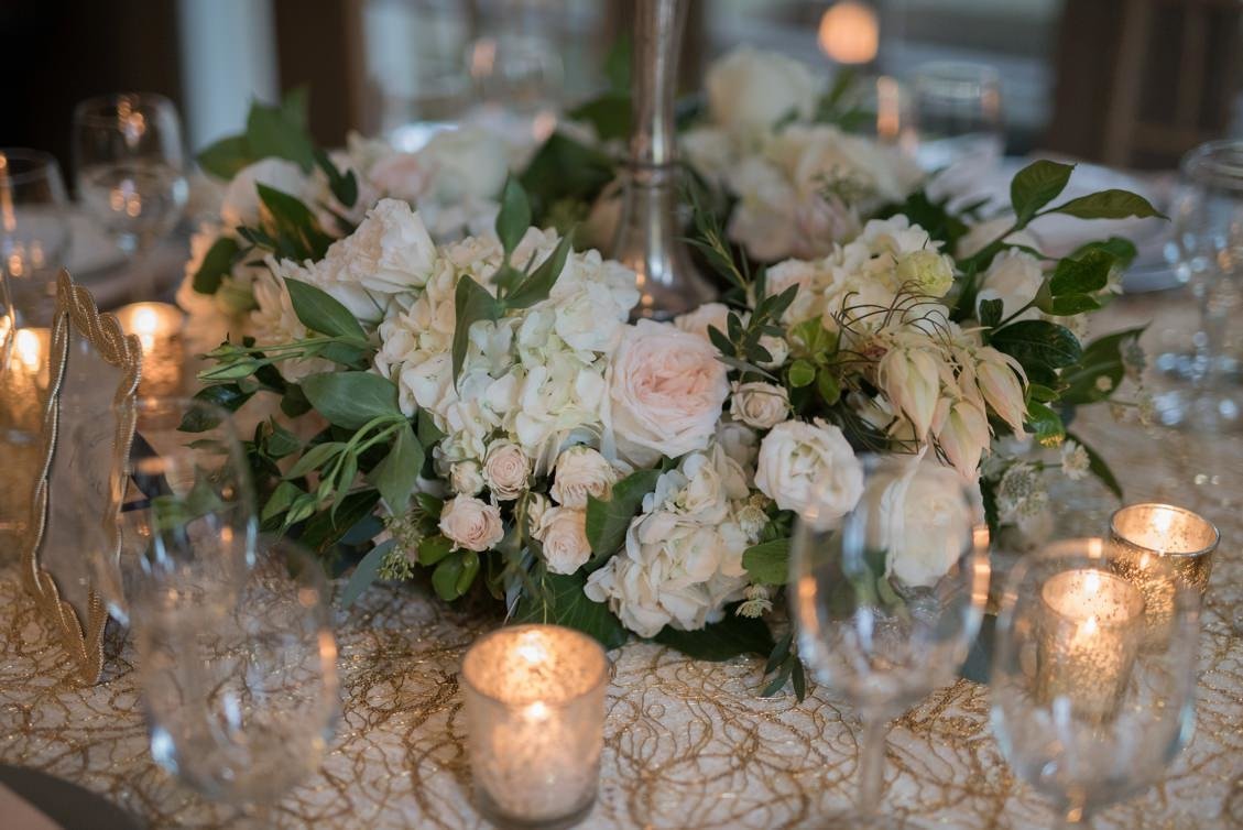 Classic wedding tablescape and placesetting in gold, champagne, silver, white and blush at Lord Thompson Manor, CT