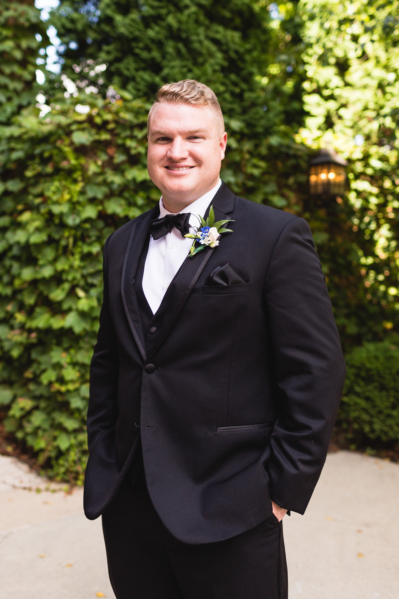 groom posing for portrait for summer wedding corazon ohio