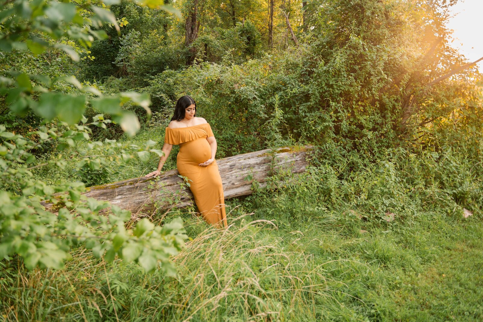 Woman in maternity gown at Oregon Ridge in Baltimore maryland.