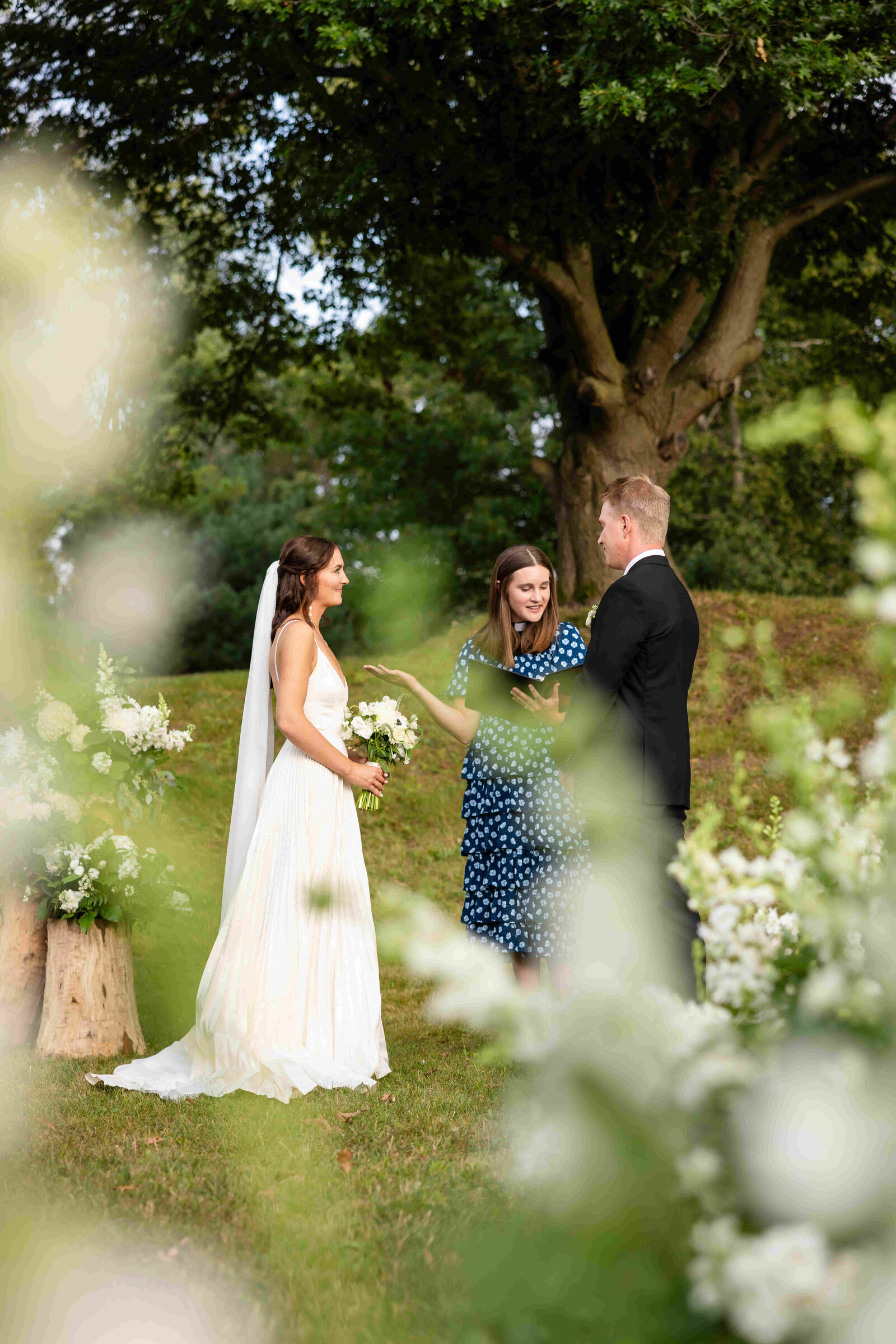 bride and groom standing at altar at their outdoor ceremony