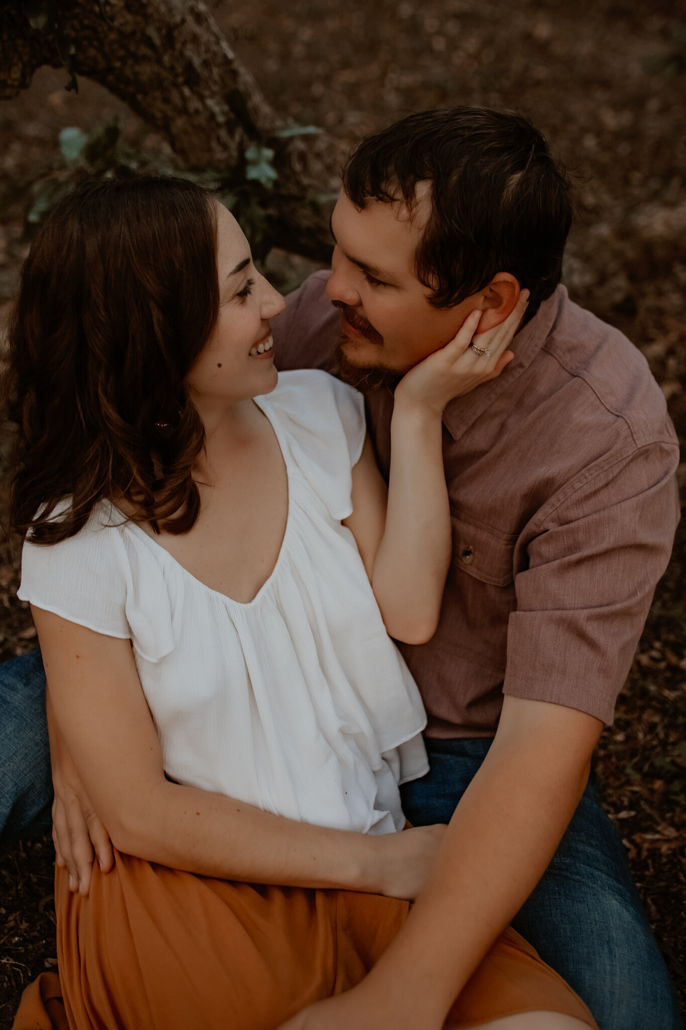 Couples photography in Cleveland TX - intimate close-up of couple smiling into each other's eyes