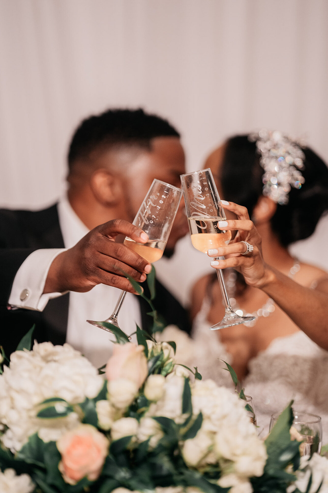 bride and groom toasting at luxury wedding reception