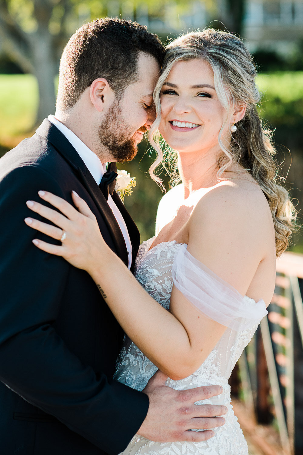groom snuggle into brides face