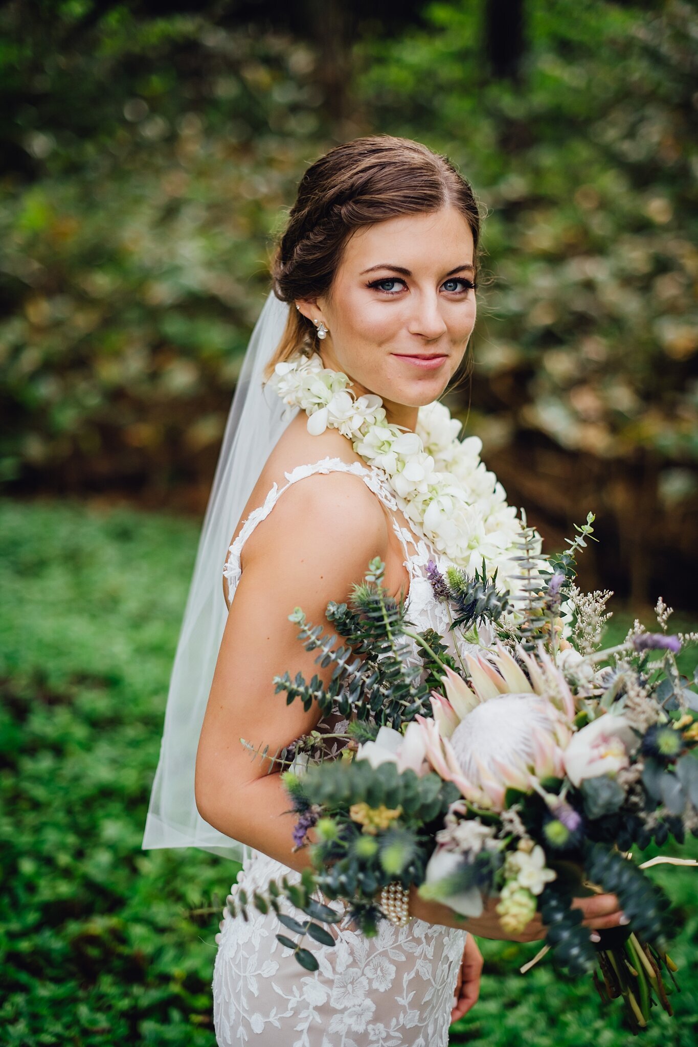 bride shows her beautiful bouquet