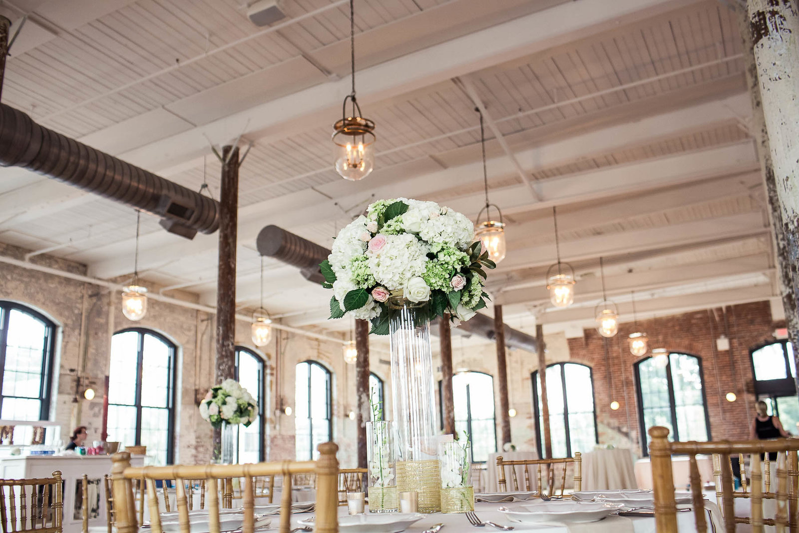 Tall flower centerpieces adorn The Cedar Room, Charleston, South Carolina