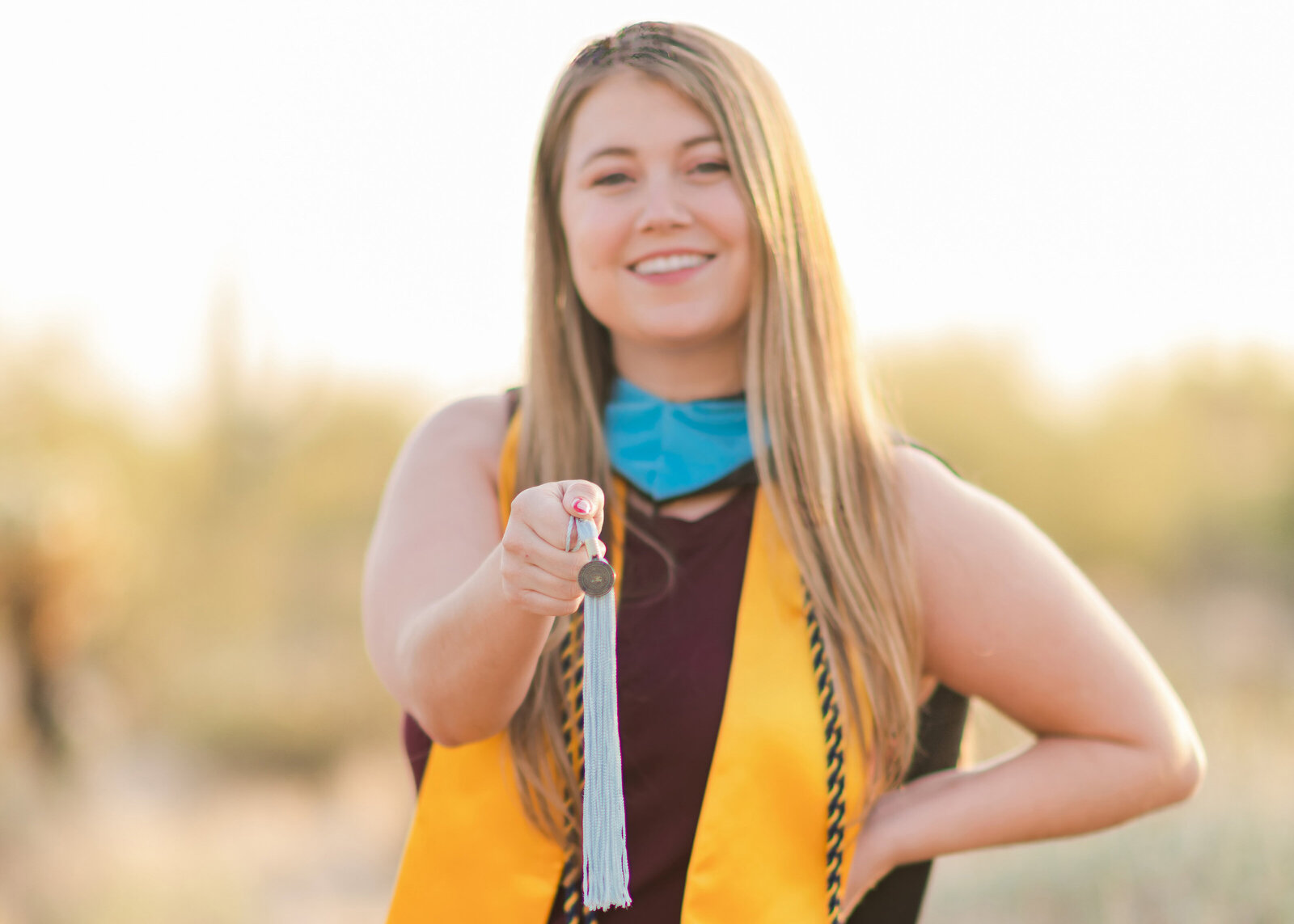 northern arizona graduate posing in the north scottsdale az desert