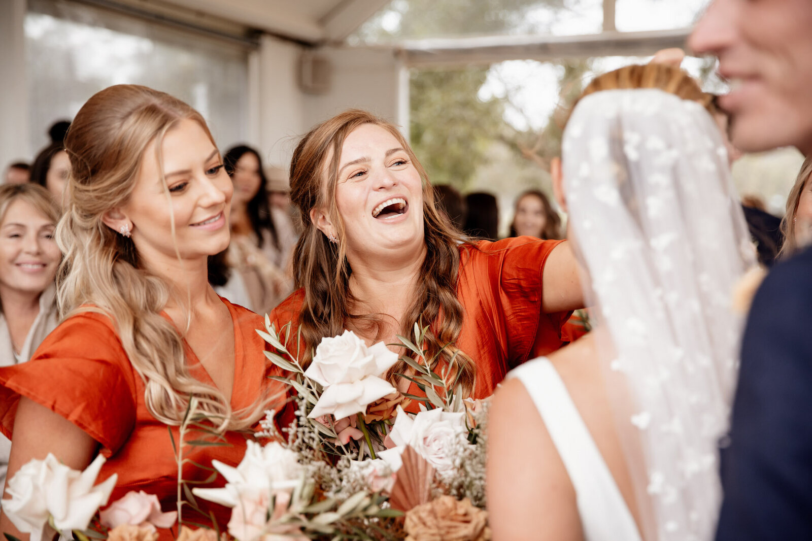 bridesmaids smile and congratulate  bride