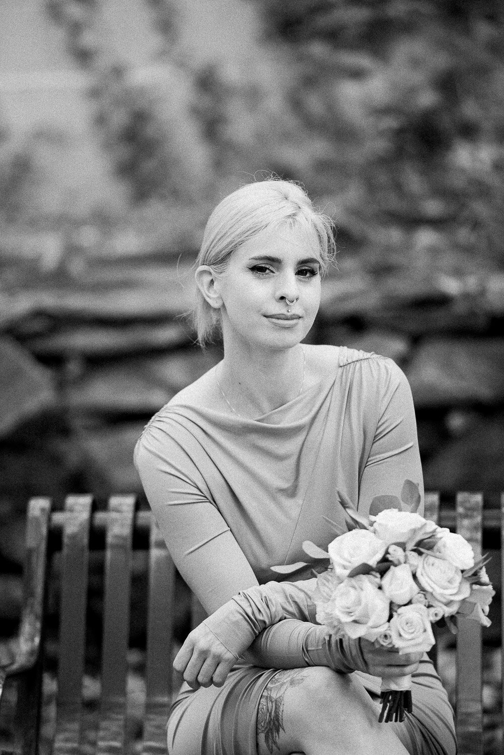 bridesmaid sitting with bouquet