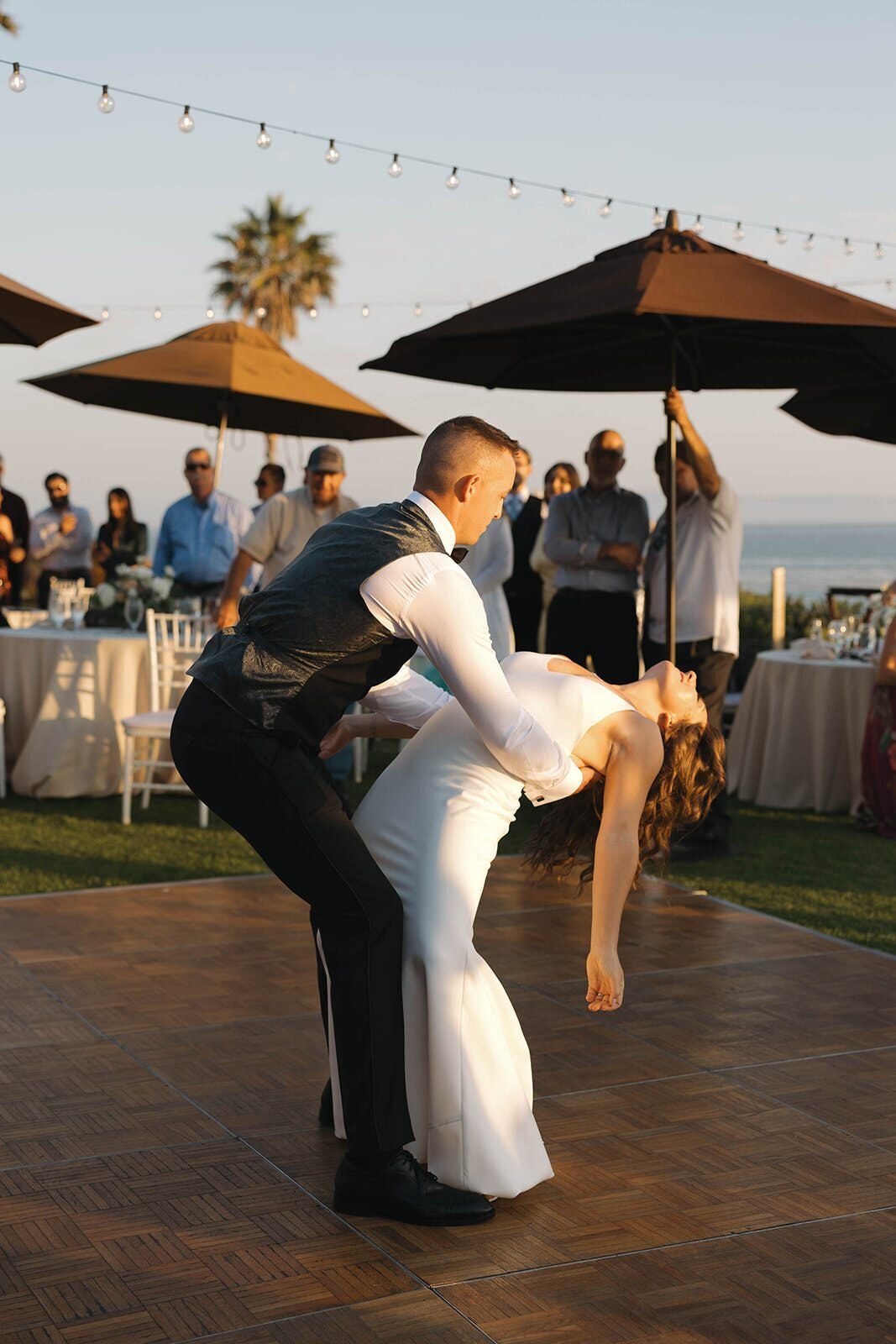 Groom dipping the bride during their first dance