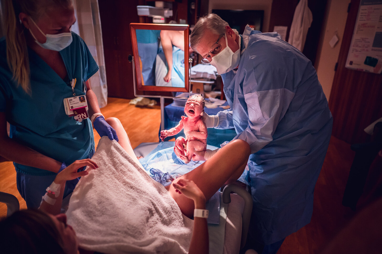 Indianapolis doctor delivering baby