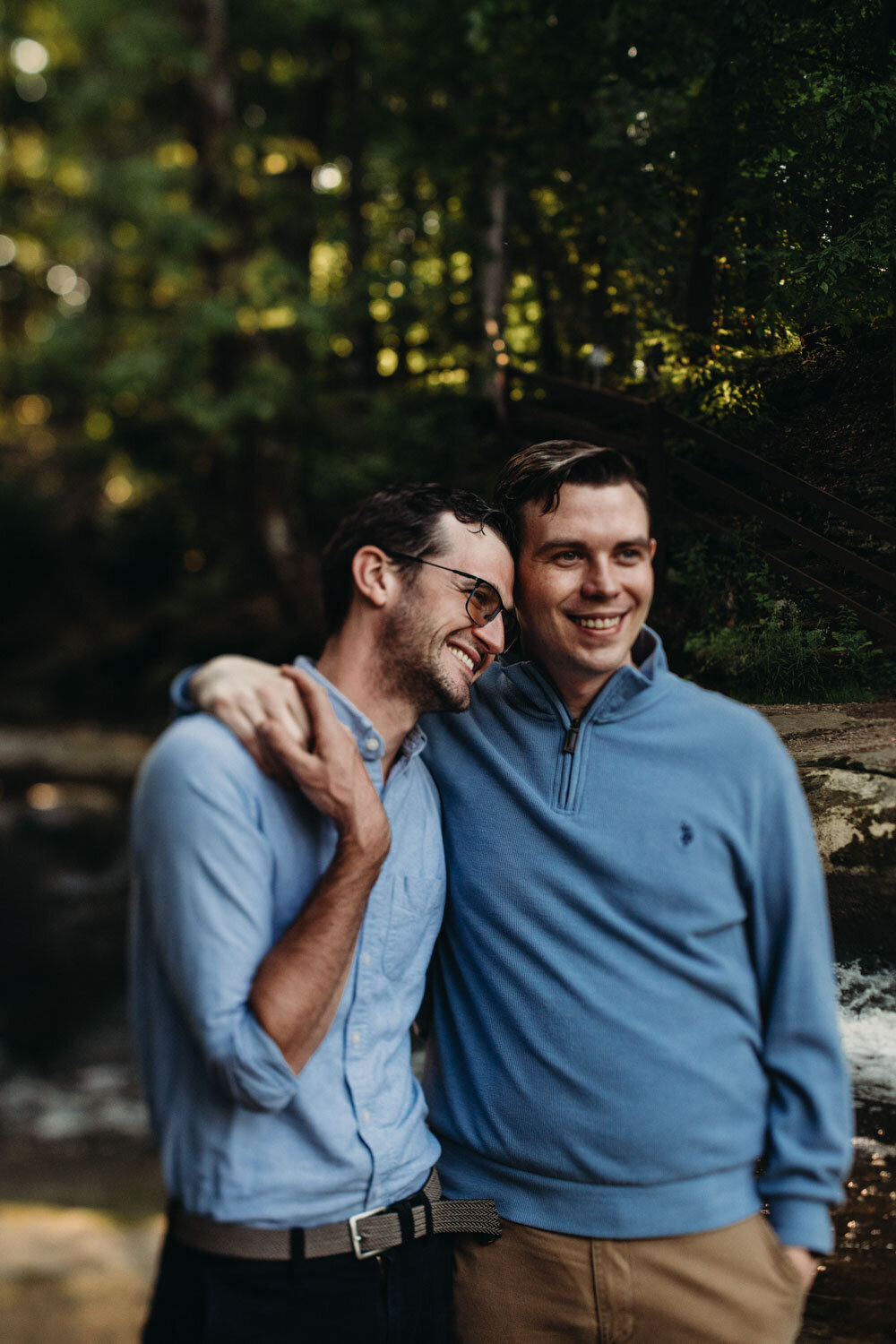 LGBTQ couple at waterfall park for engagment session