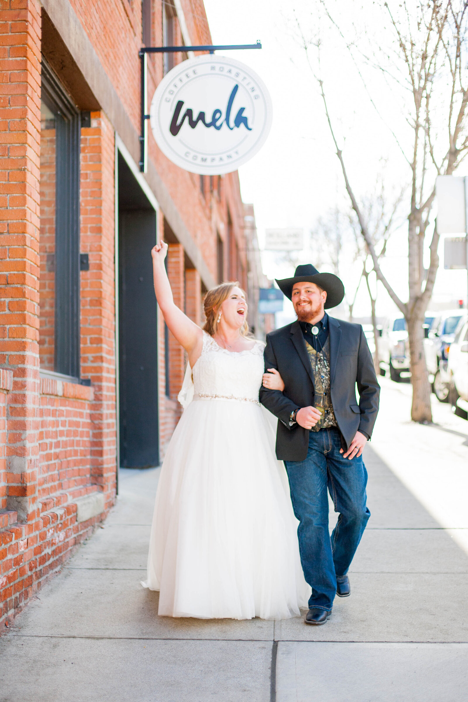 A Leavenworth wedding photography shoot with a man and woman walking downtown.