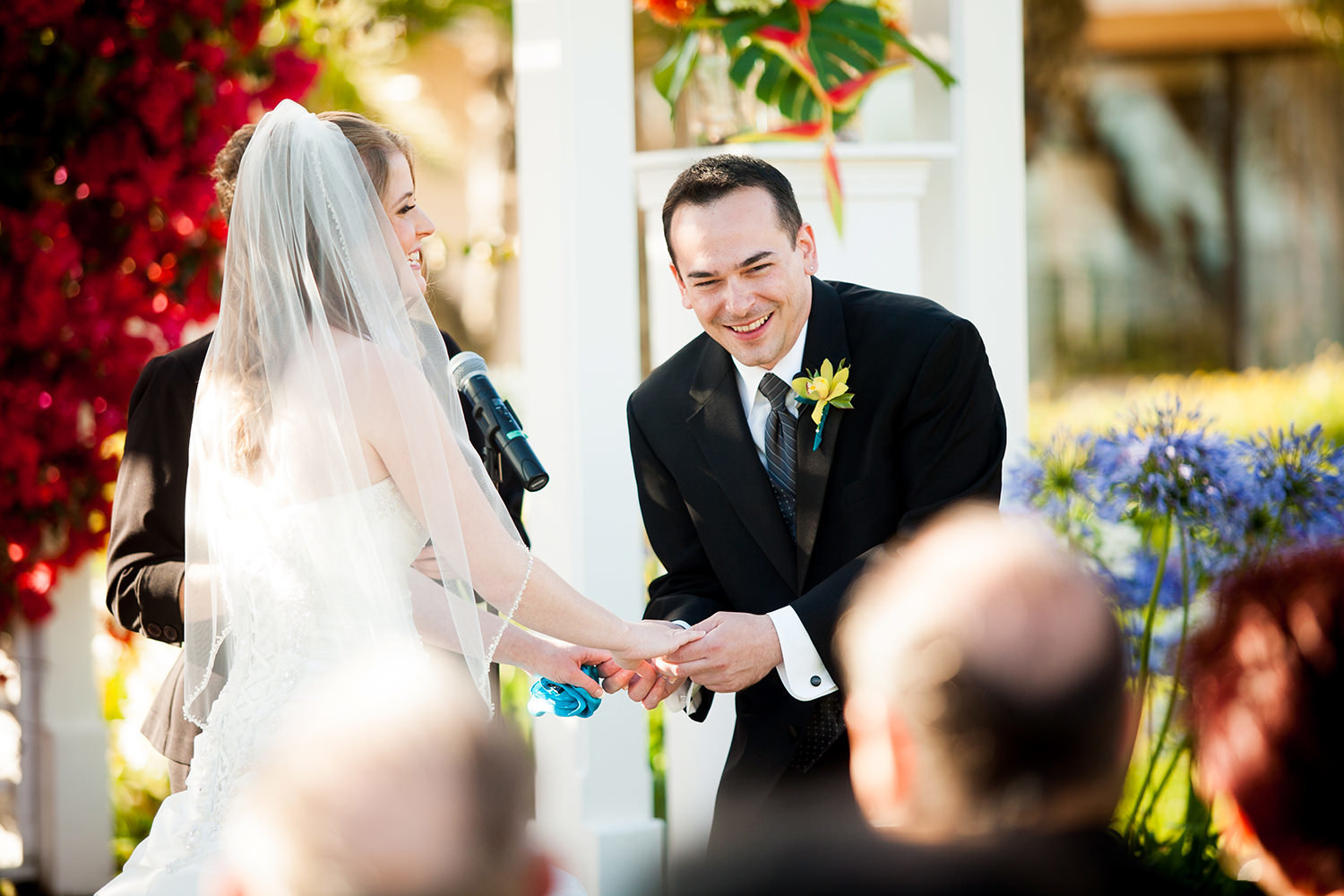 groom laughing at bride at ceremony