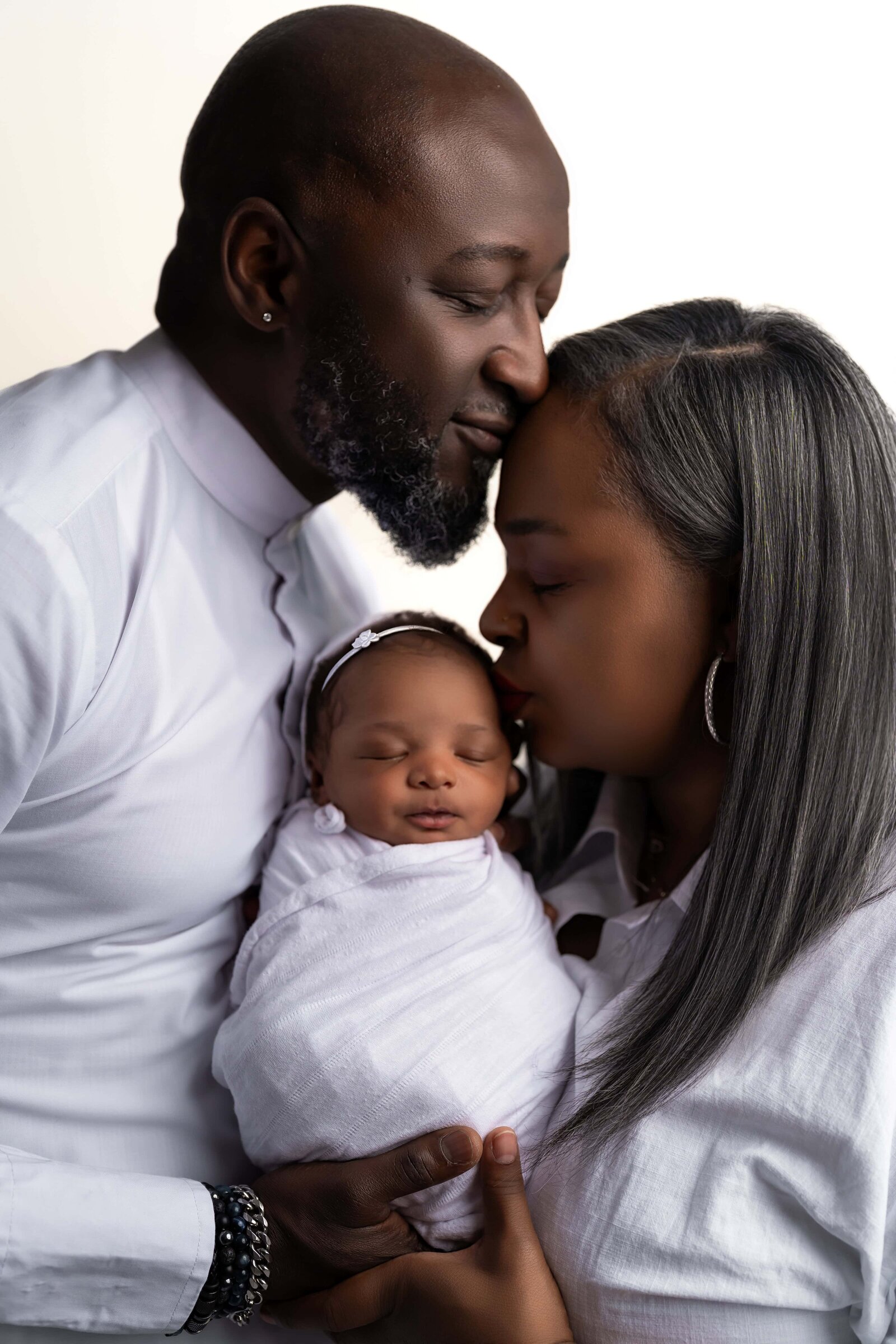 Baby with mom and dad taken in a studio in Chicago