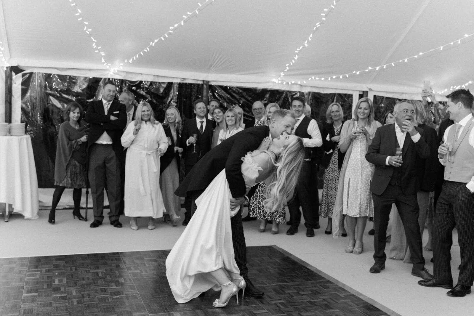 black and white photo of bride and groom first dance