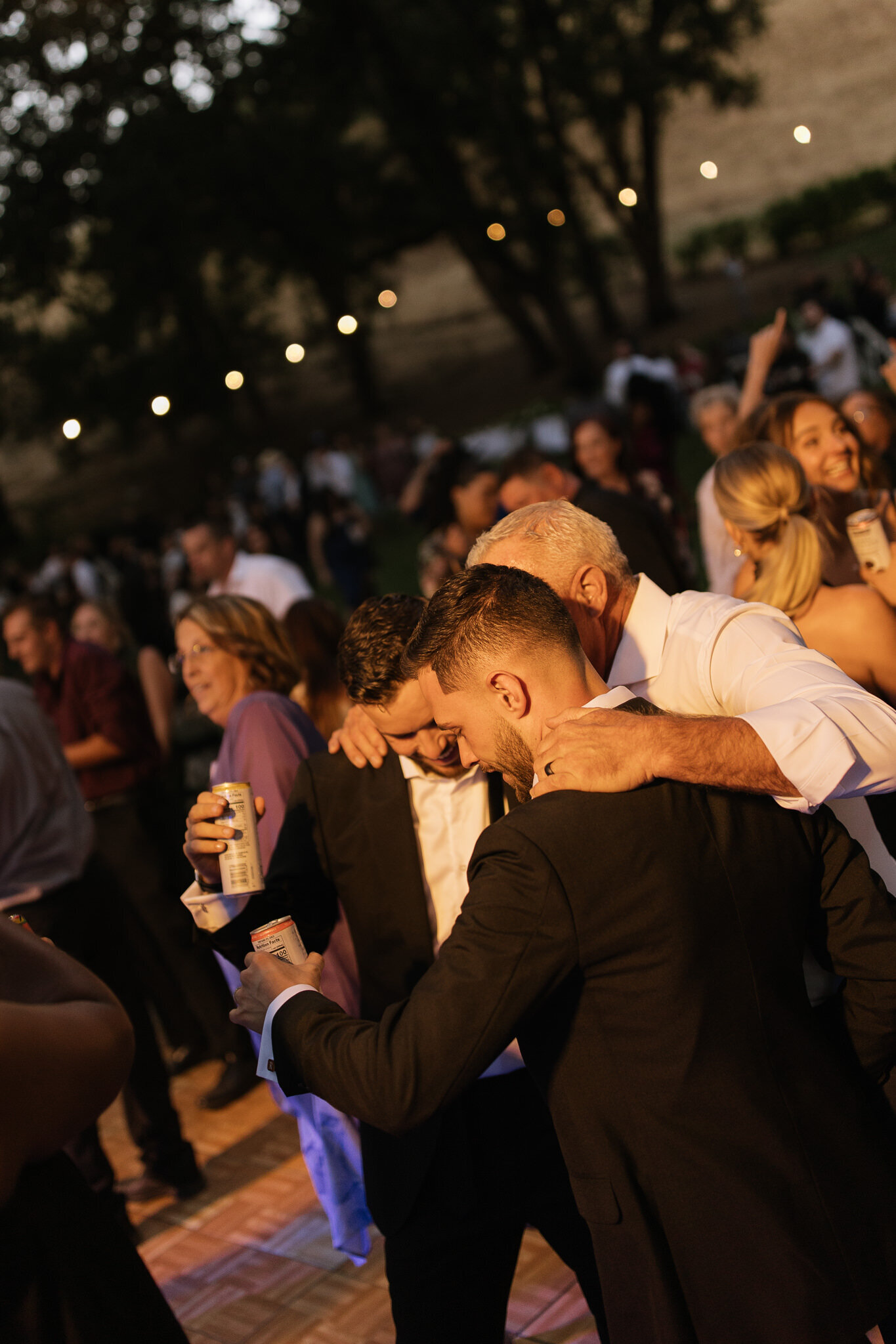 Grooms laughing and smiling on dance floor by Erica Rochelle photography, best Northern California wedding photographers