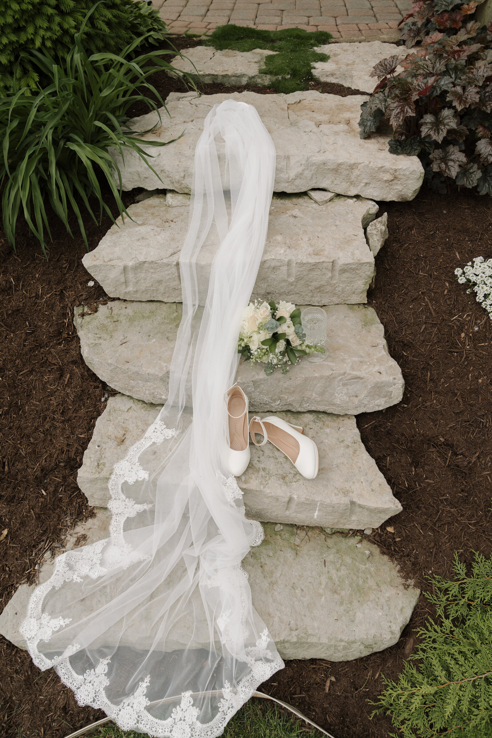 wedding detail photos with the veil shoes and ring
