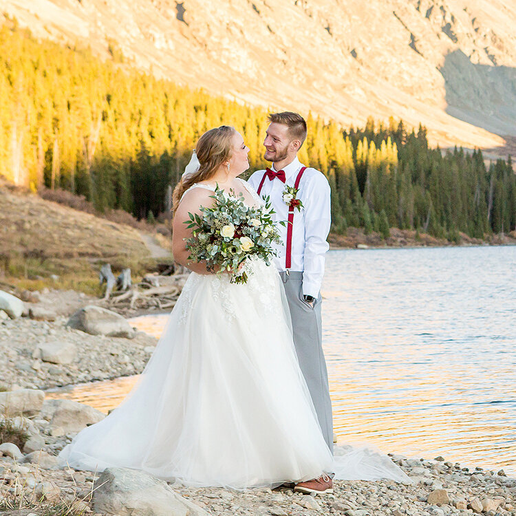 Colorado wedding photographer with couple at Clinton Gulch Dam Reservoir