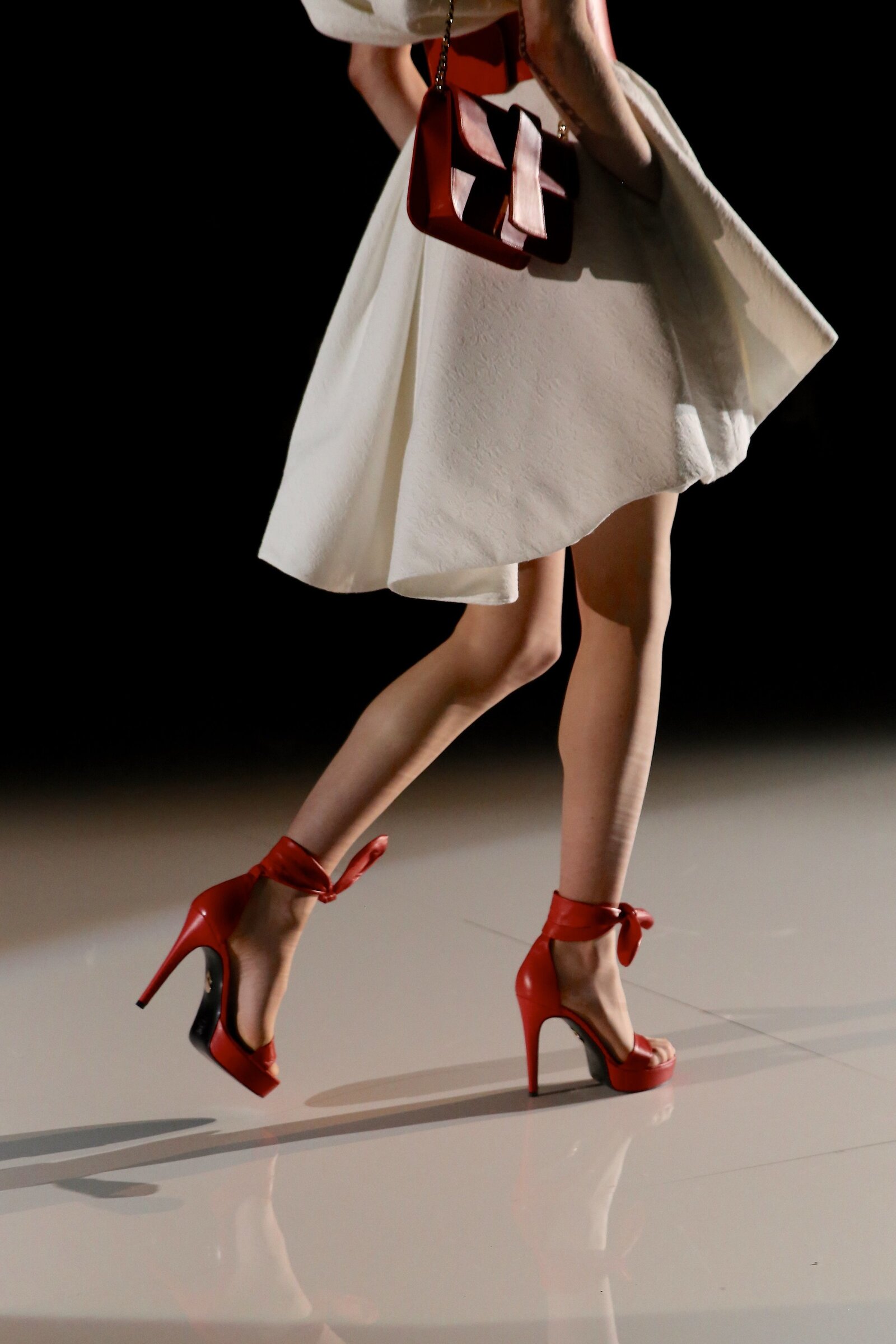 Red Heels and Luxurious dress on the runway by fashion photographer Chelsea Loren.