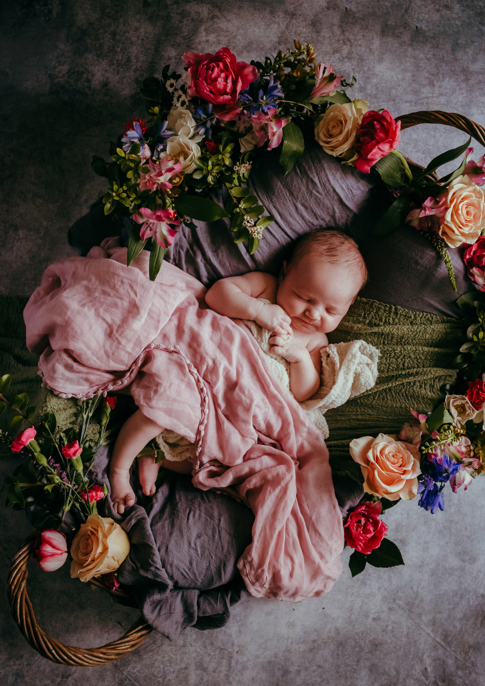 rootedandwildphotography_bremerton_newborn_in_basket_with_flowers
