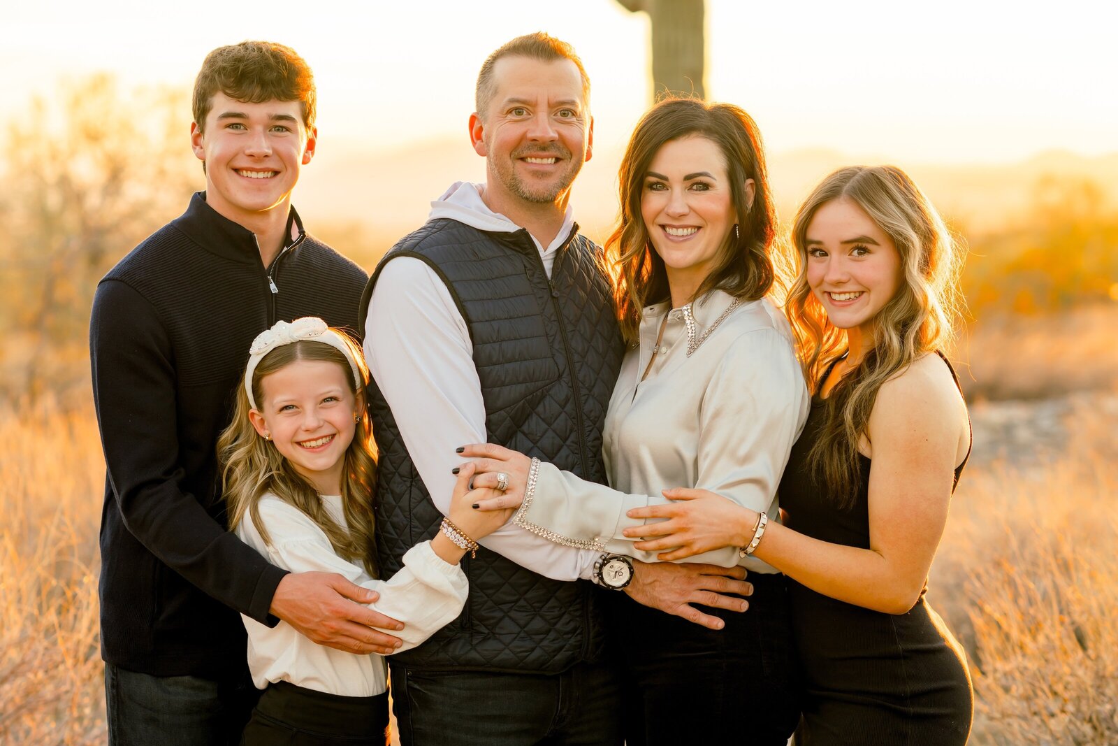 family of five posing for a family photo in north scottsdale 