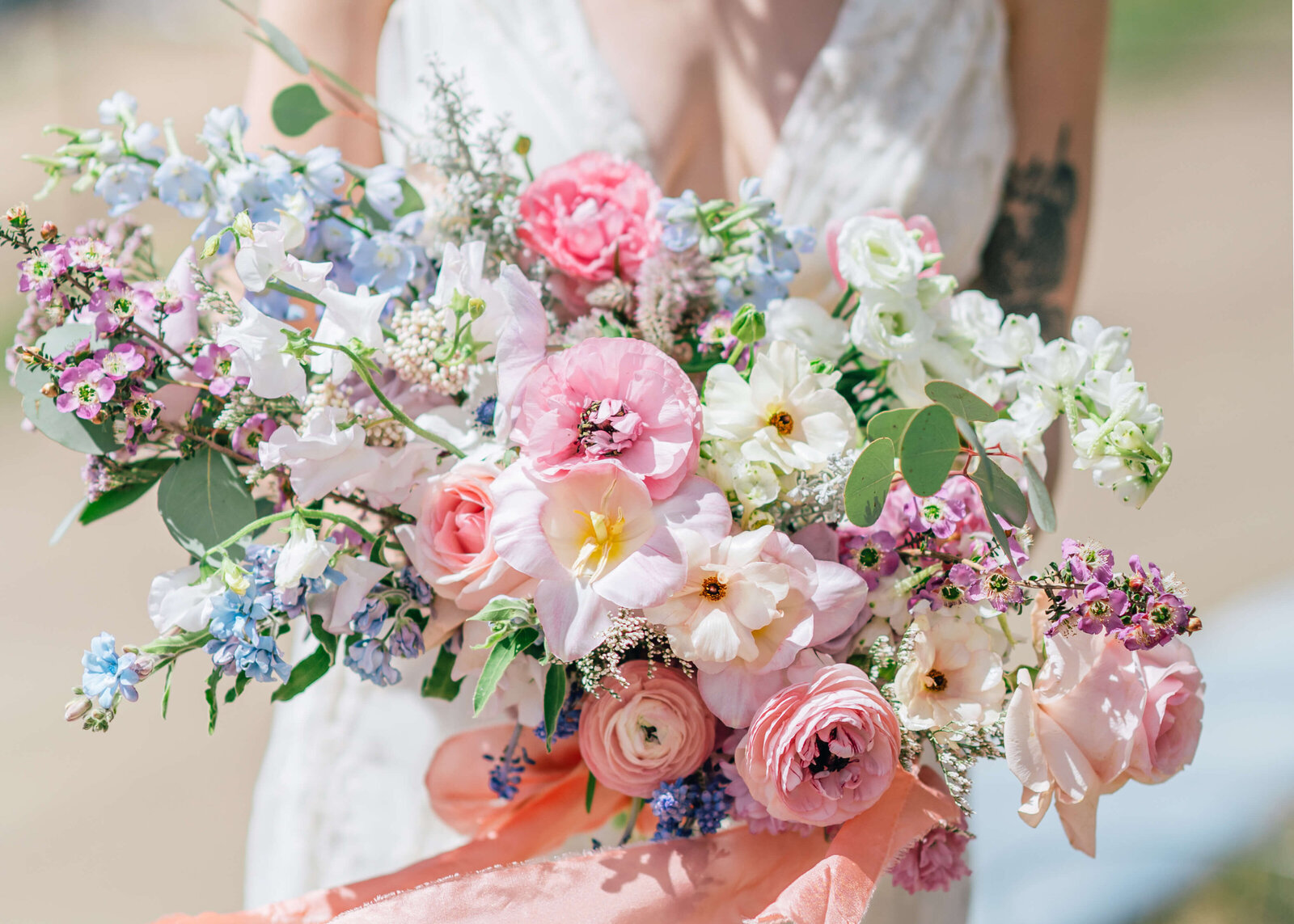 Virginia wedding photographer captures an image of a vibrant and pink floral bouquet