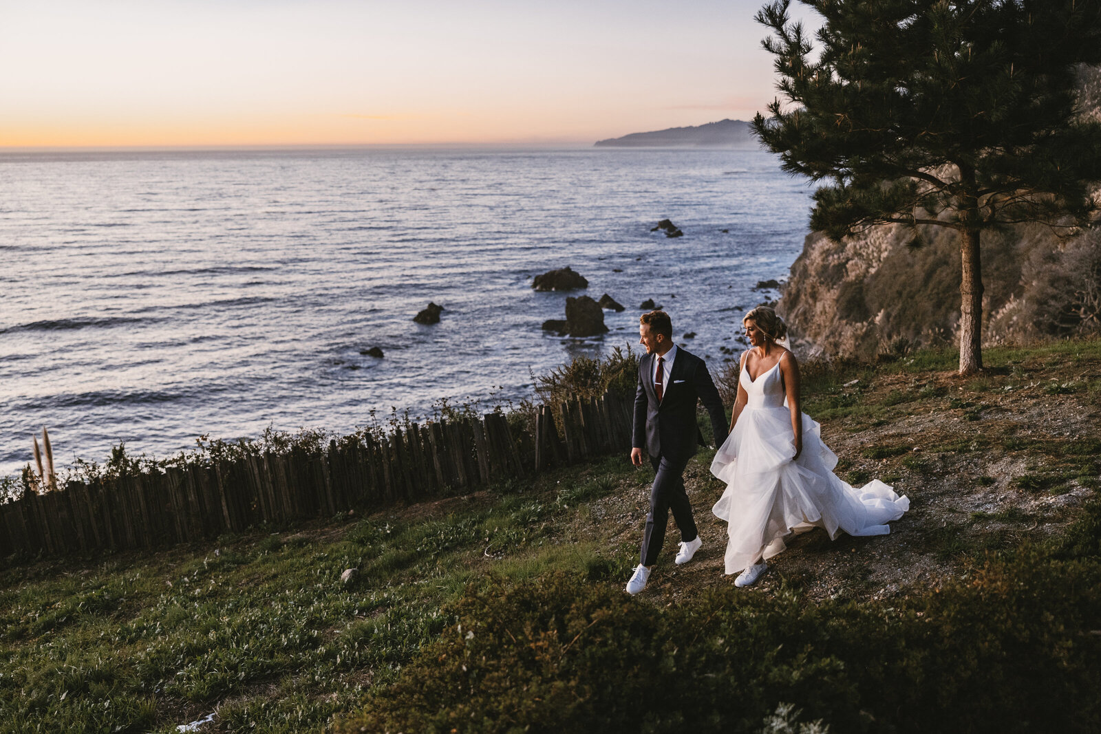 Couple walking at Sunset by Ocean